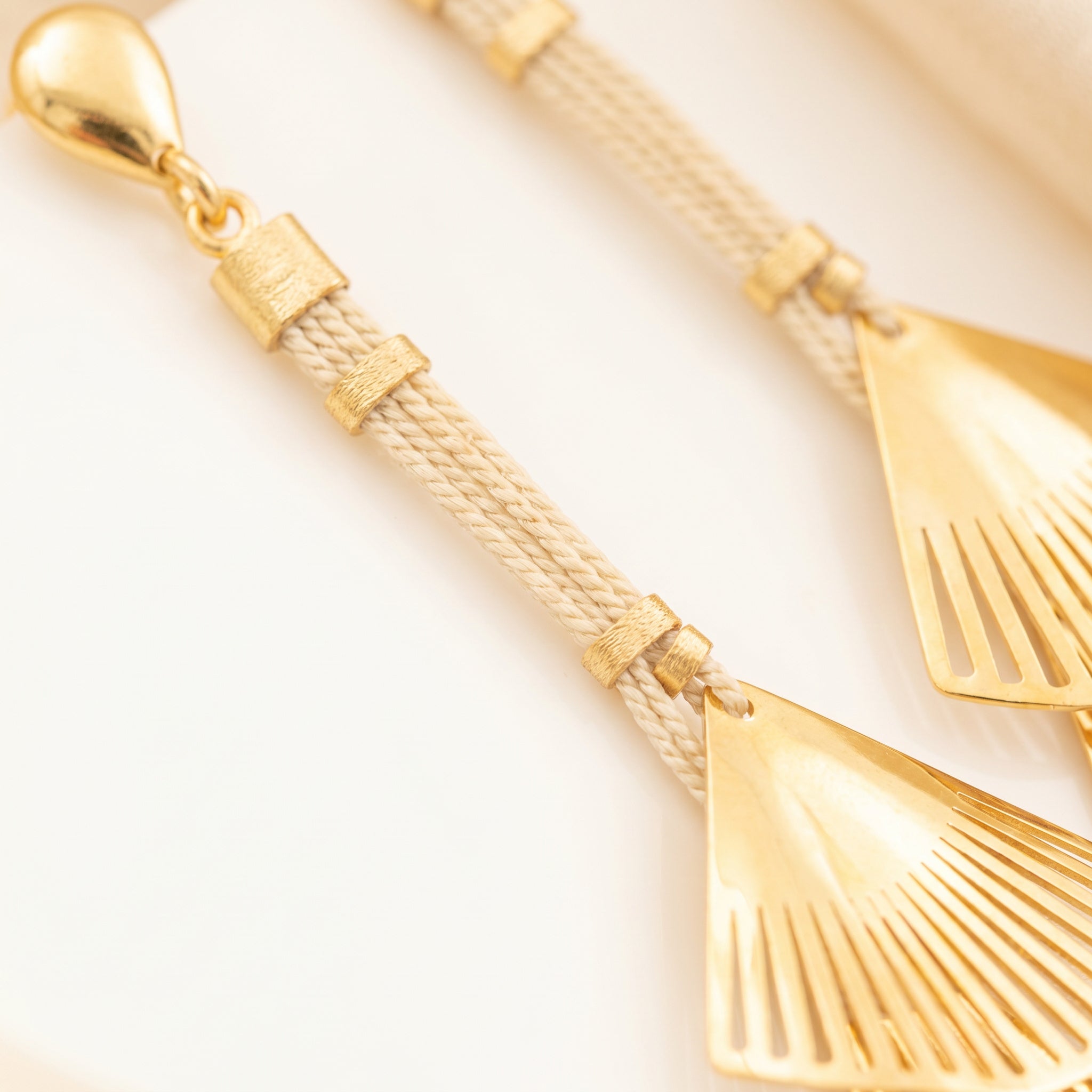 Purplee Store Buriti Artisanal Isolde Earrings with fan-shaped designs on a light background