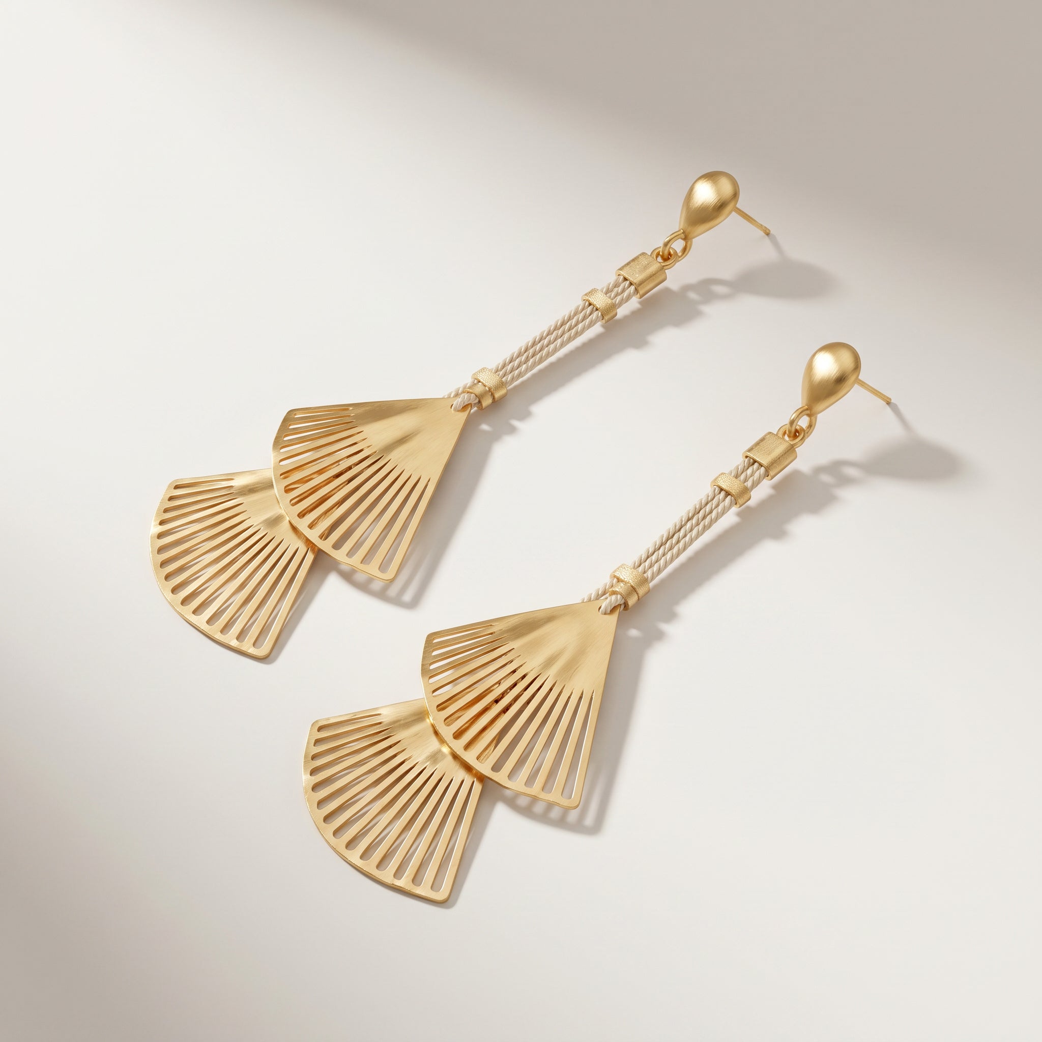 Purplee Store Buriti Artisanal Isolde Earrings with fan-shaped design on a light background