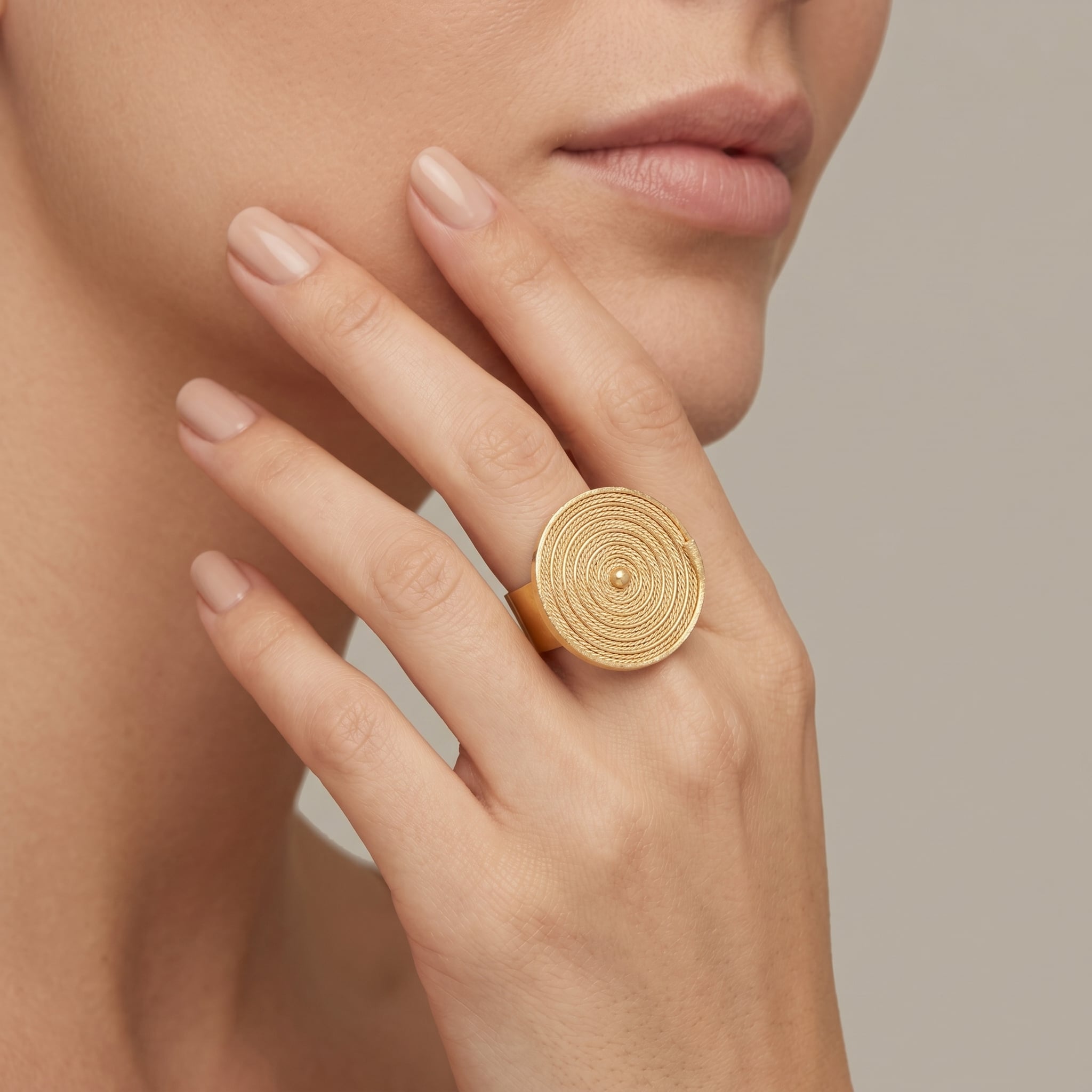 Close-up of a hand wearing Buriti Seryne Ring | Exotic Vegan Silk on a neutral background