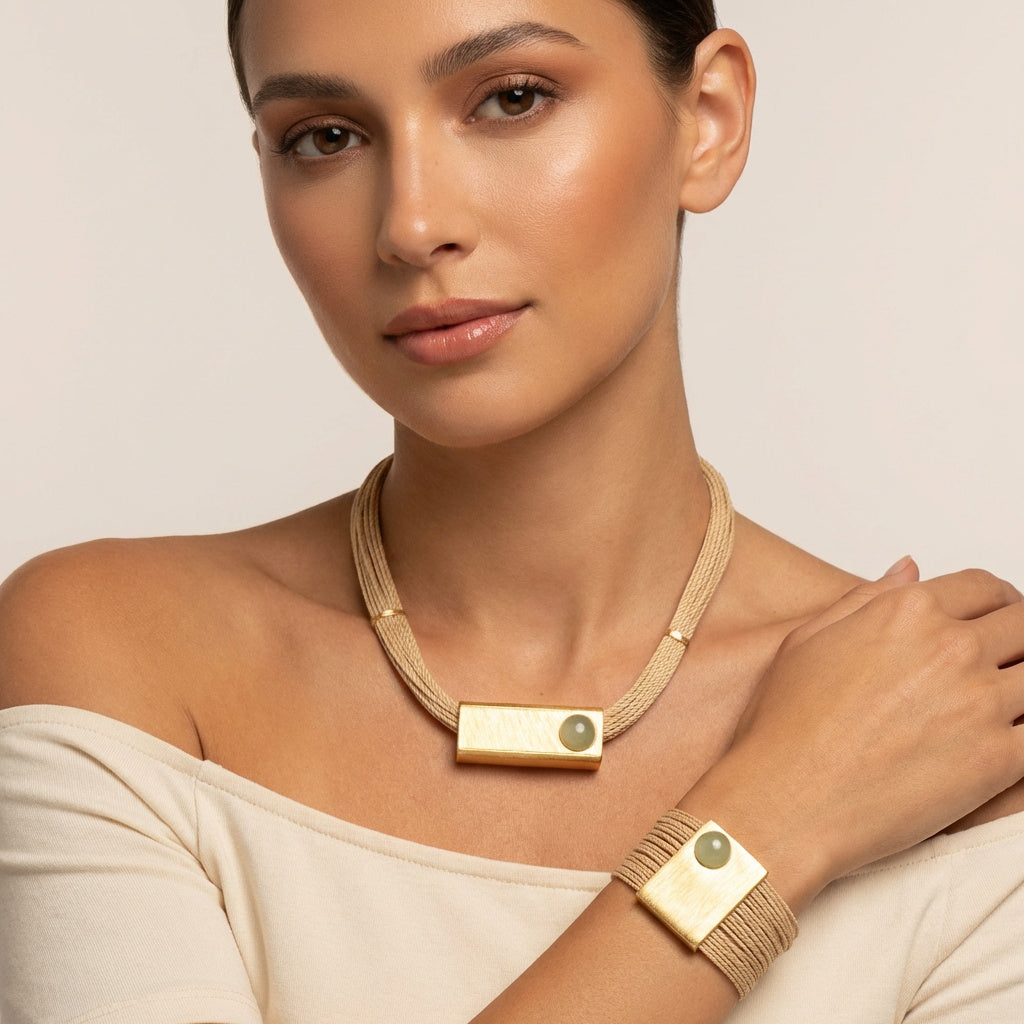 Woman wearing a Handcrafted Buriti Orvellia Necklace with Natural Stones and 18k Gold against a neutral background. Purplee Store