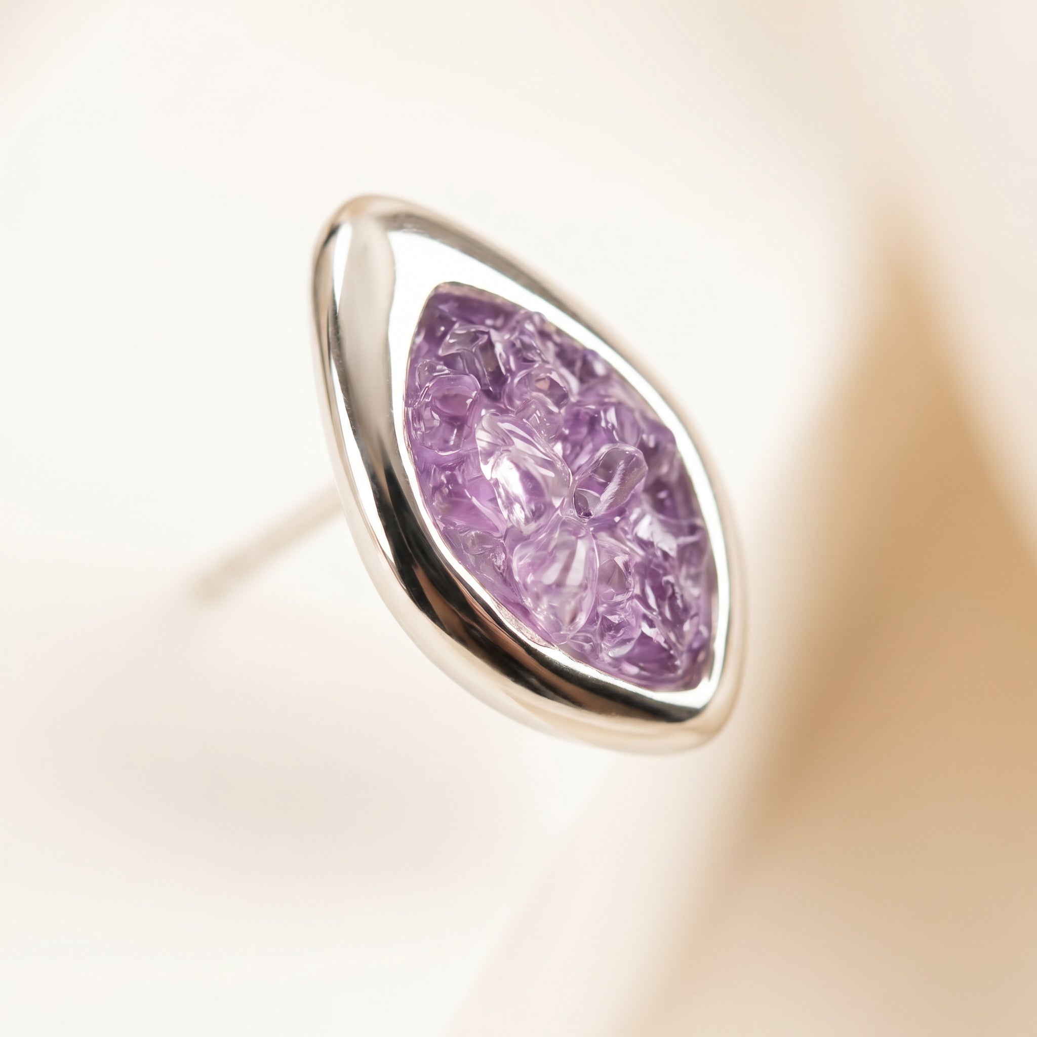 Close-up on PIORELLE Amethyst Birthstone Earrings on a light background|Purplee Store