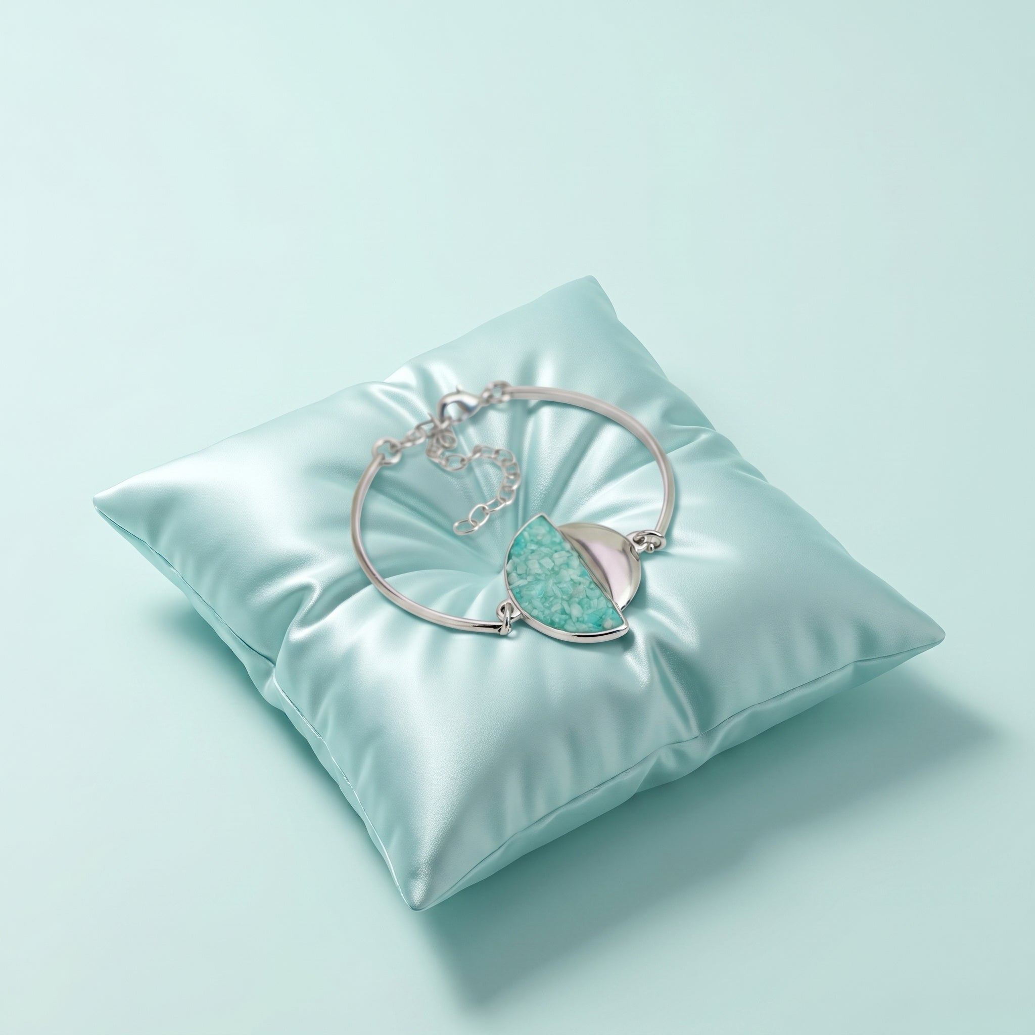 Purplee Store PIORELLE Green Amazonite Birthstone Bracelet on a light blue pillow against a light blue background