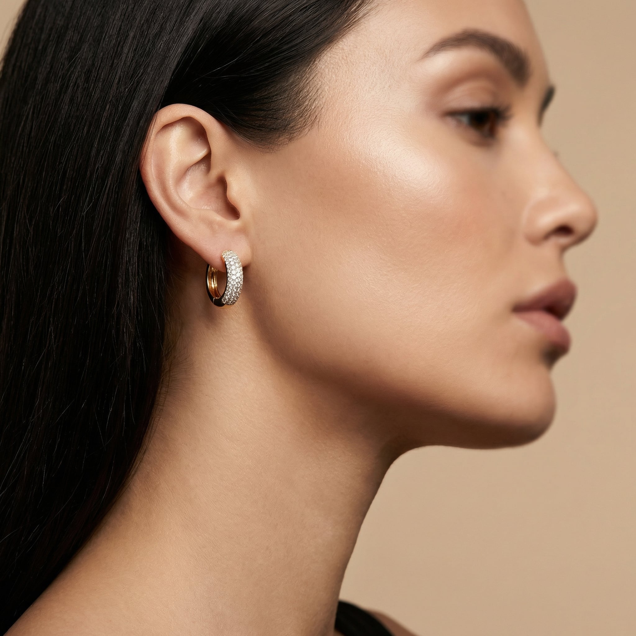 Elegante woman using a Lumina Gemstone Huggie Hoops |Purplee Store