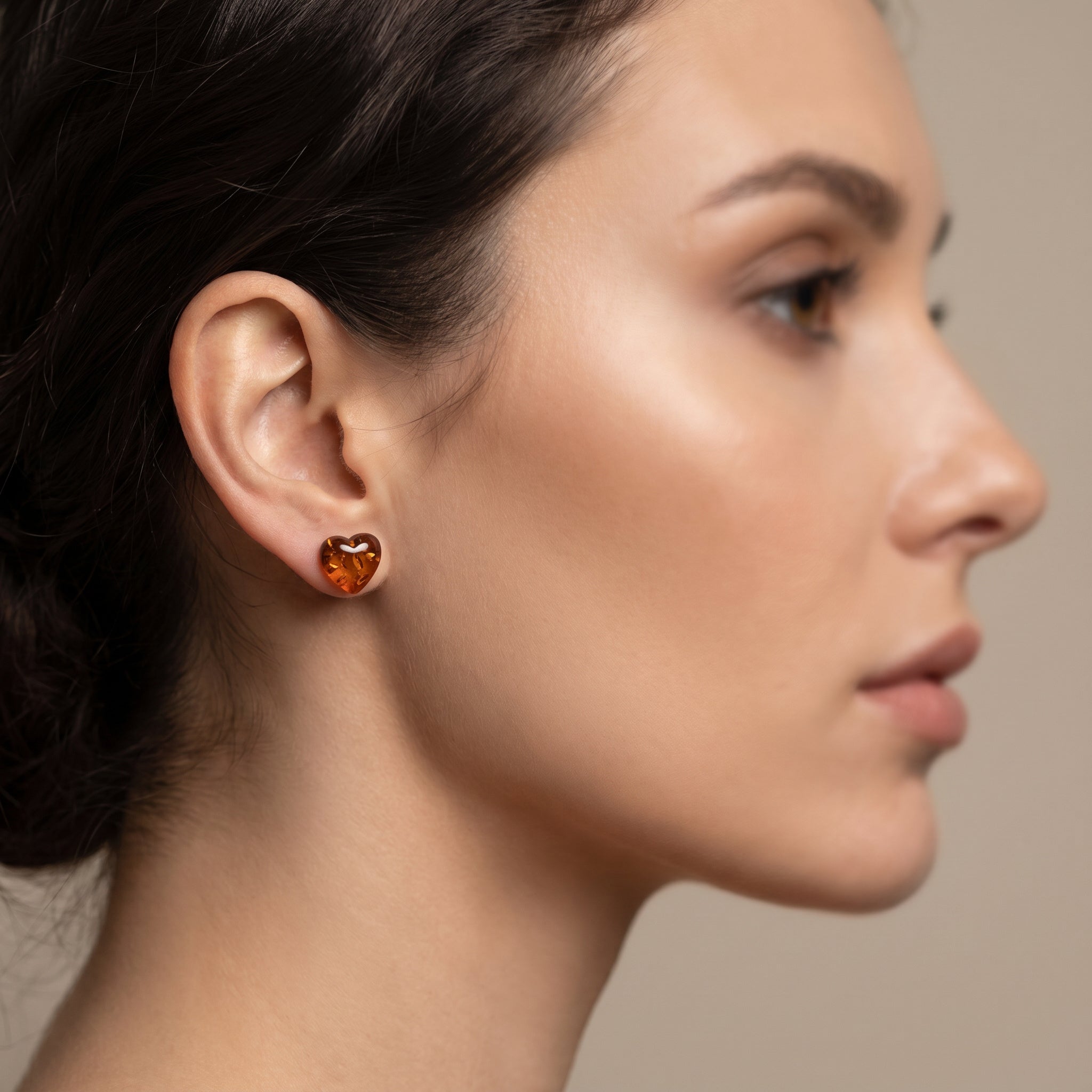 Close-up of a woman wearing a Amber Heart 925 Silver Studs|Purplee Store