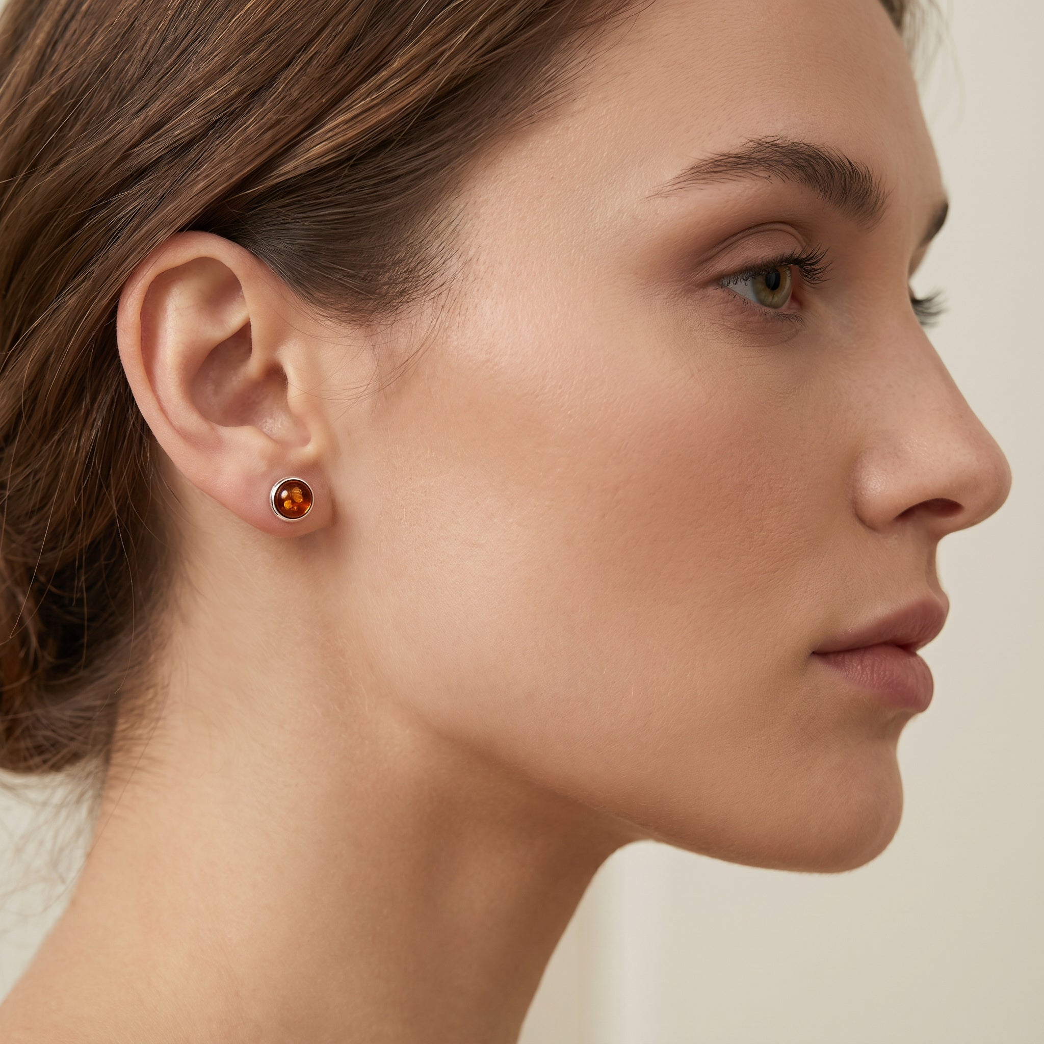 Close-up of a woman wearing a Amber Glow Cognac 925 Silver Studs|Purplee Store
