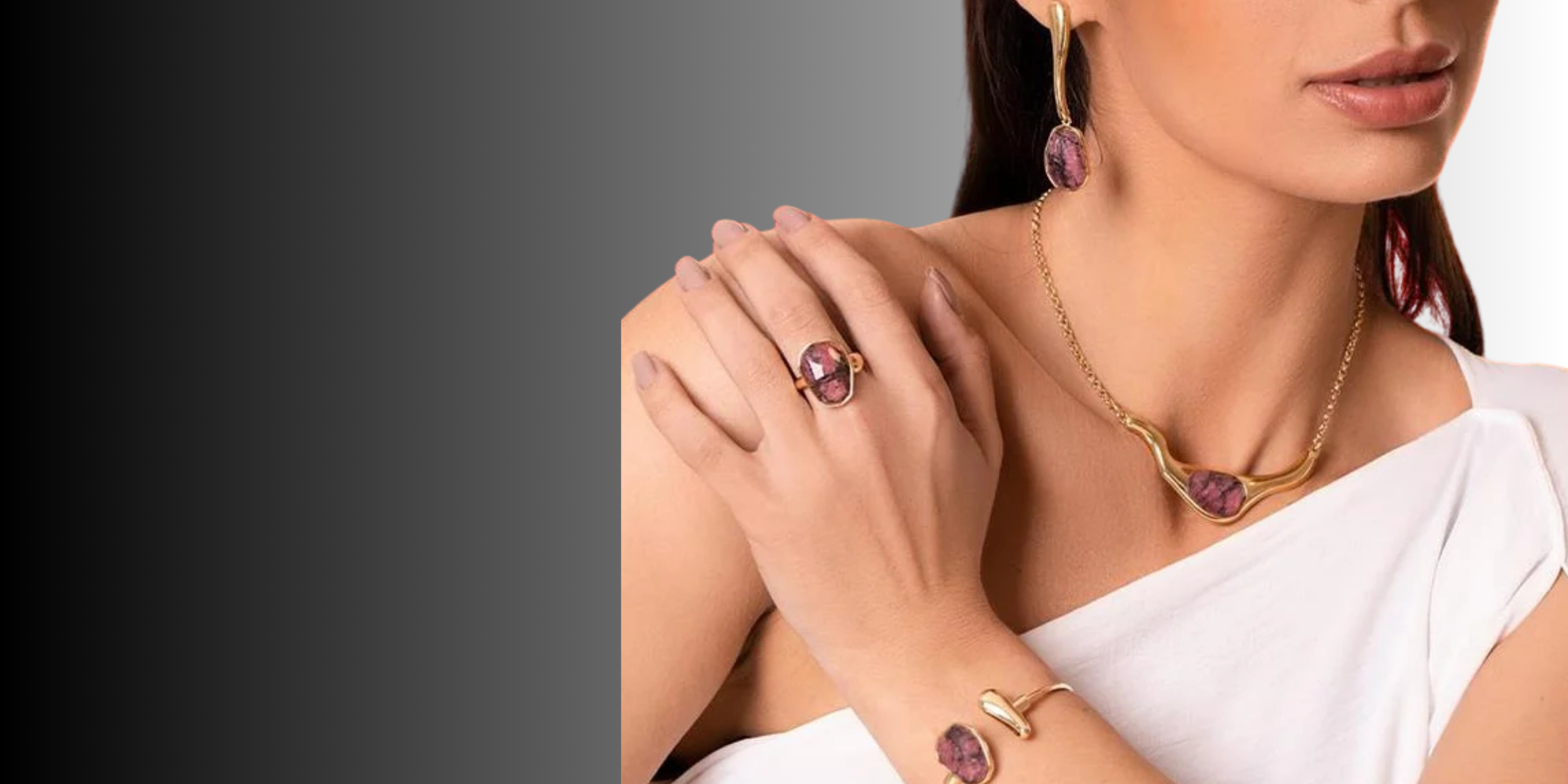 Model wearing an iconic jewelry set with natural rhodonite stone and refined gold finish| Purplee Store