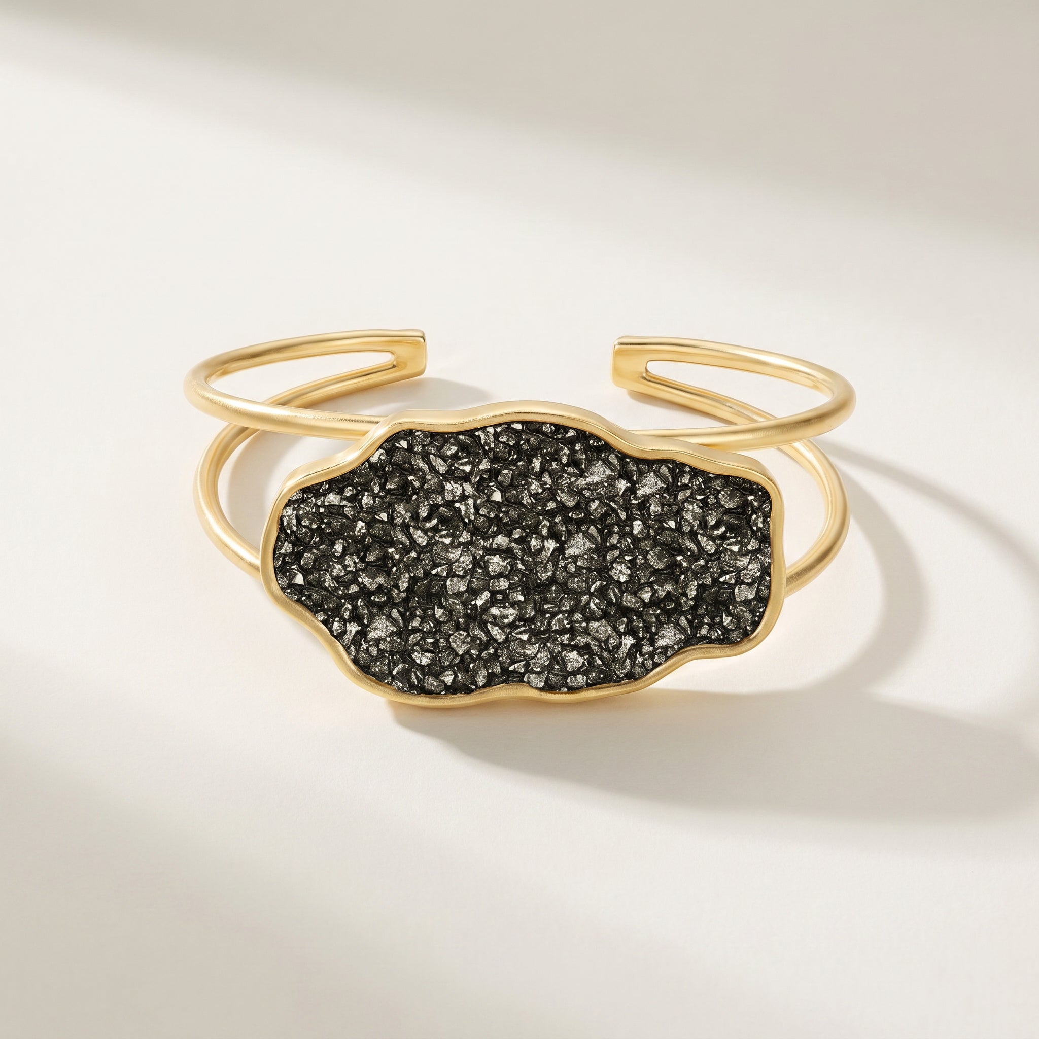 Earthly Opulence Golden Fire Pyrite Cuff| Purplee Store, textured stone on a light background