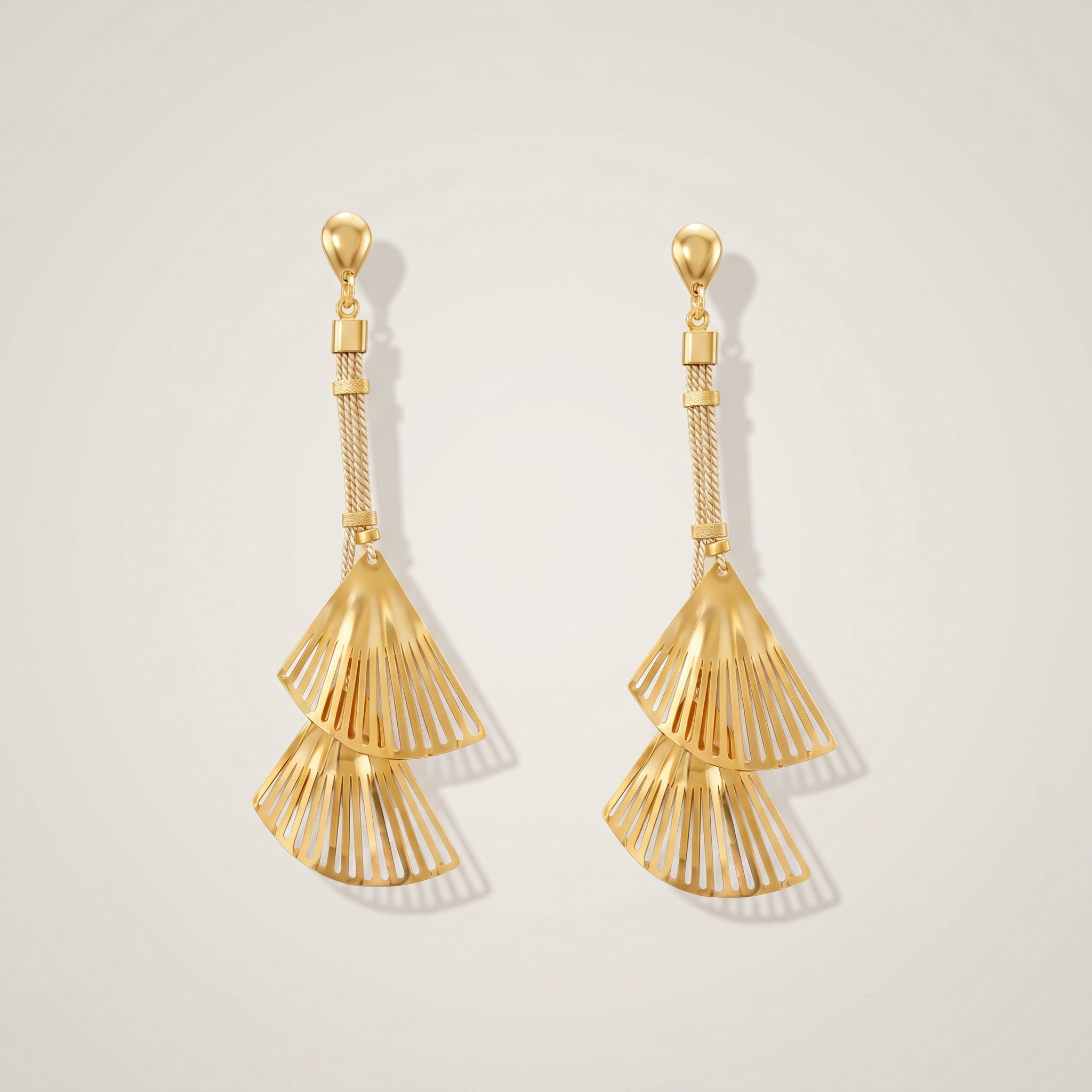 Pair of Purplee Store Buriti Artisanal Isolde Earrings on a light gray background
