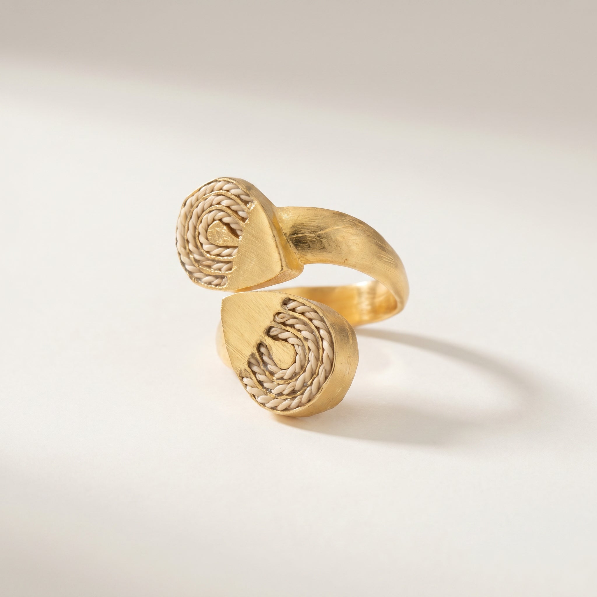 Gold ring with intricate design on a light background. Purplee Store