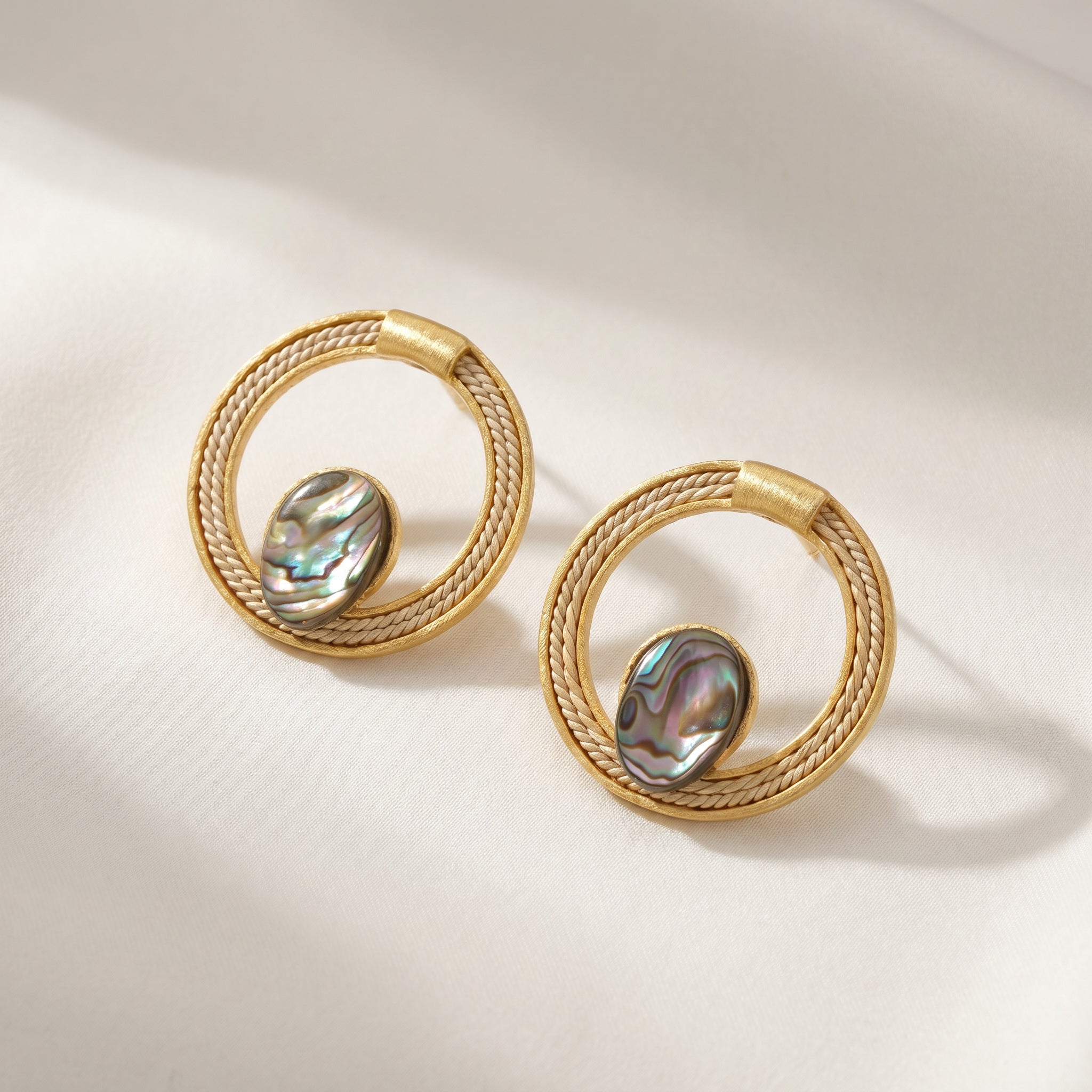 Purplee Store Buriti Statement Abrya Earrings placed on light background 