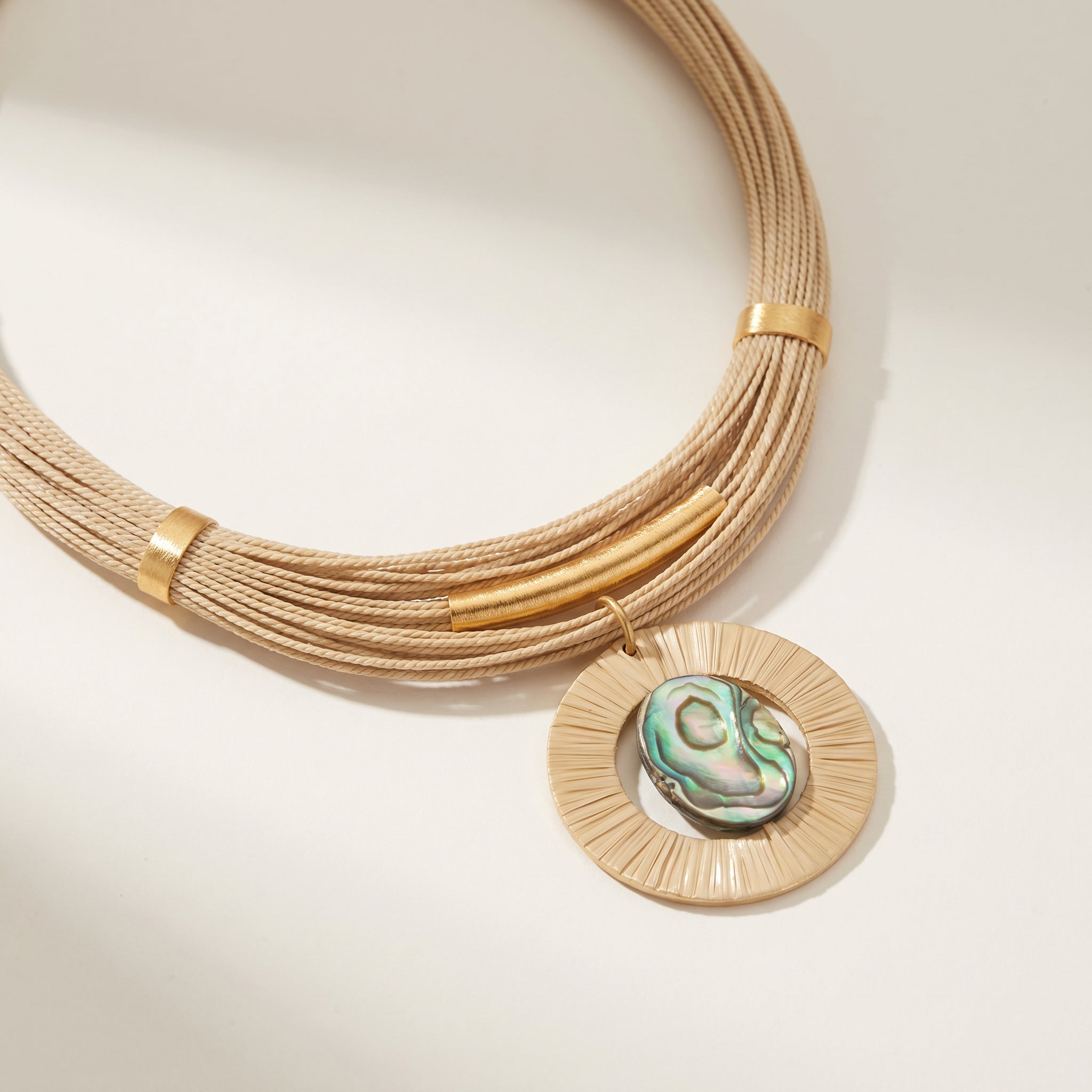 Purplee Store Buriti Artisanal Serelis Necklace on a light background