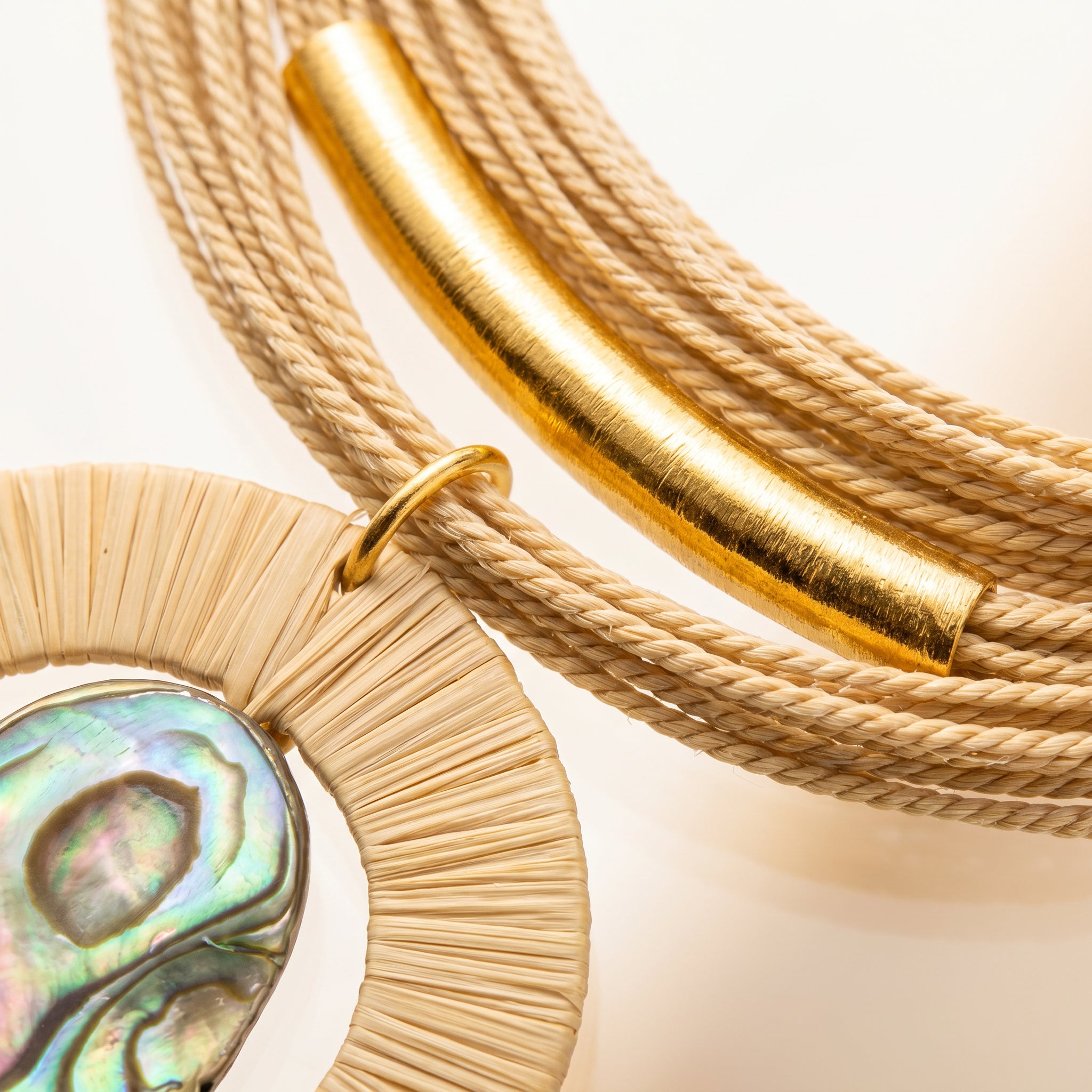 Purplee Store Buriti Artisanal Serelis Necklace with a pendant featuring a colorful stone on a light background