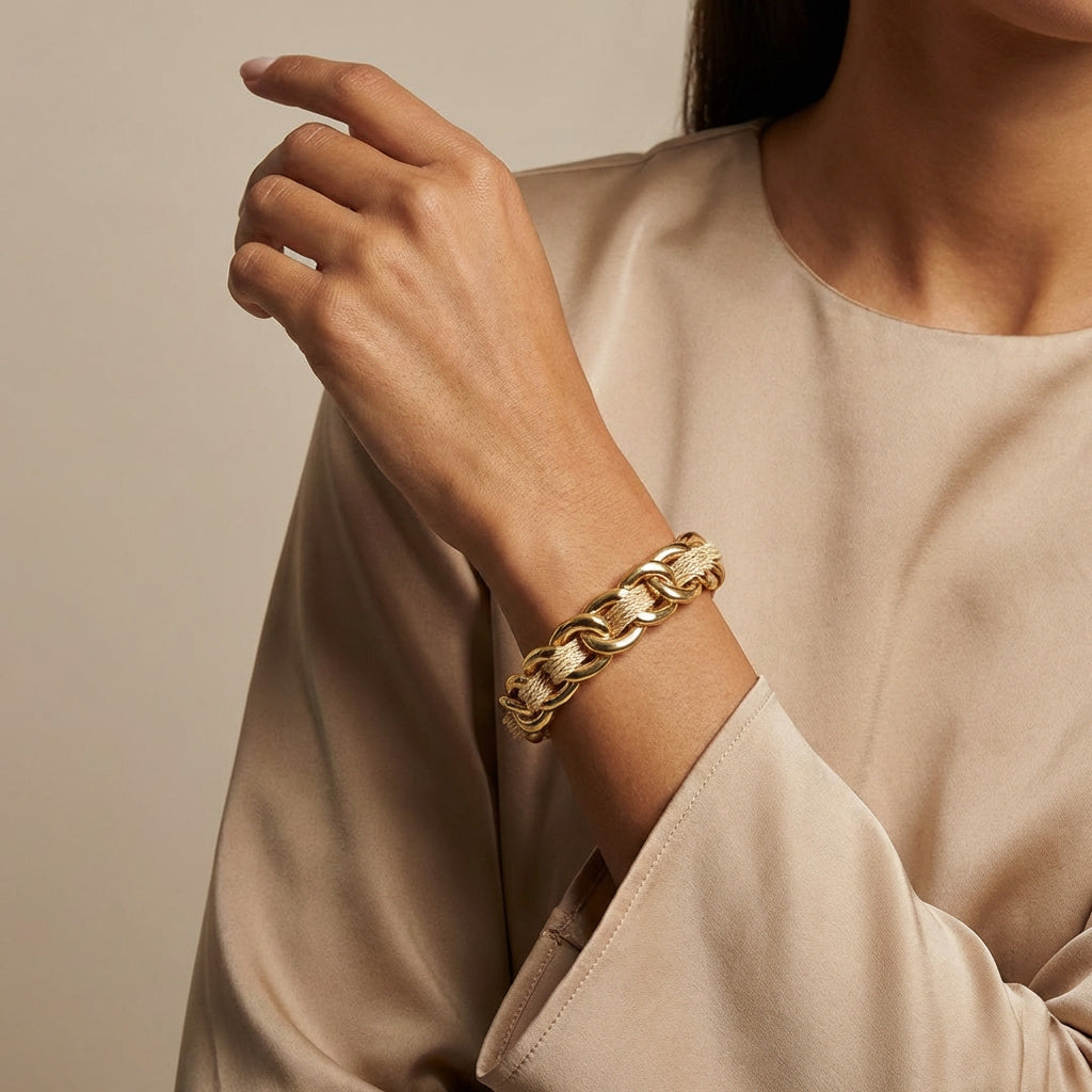 Woman using a Buriti Handcrafted Braided Bracelet with 18k Gold Finish wrist with a neutral background.Purplee Store