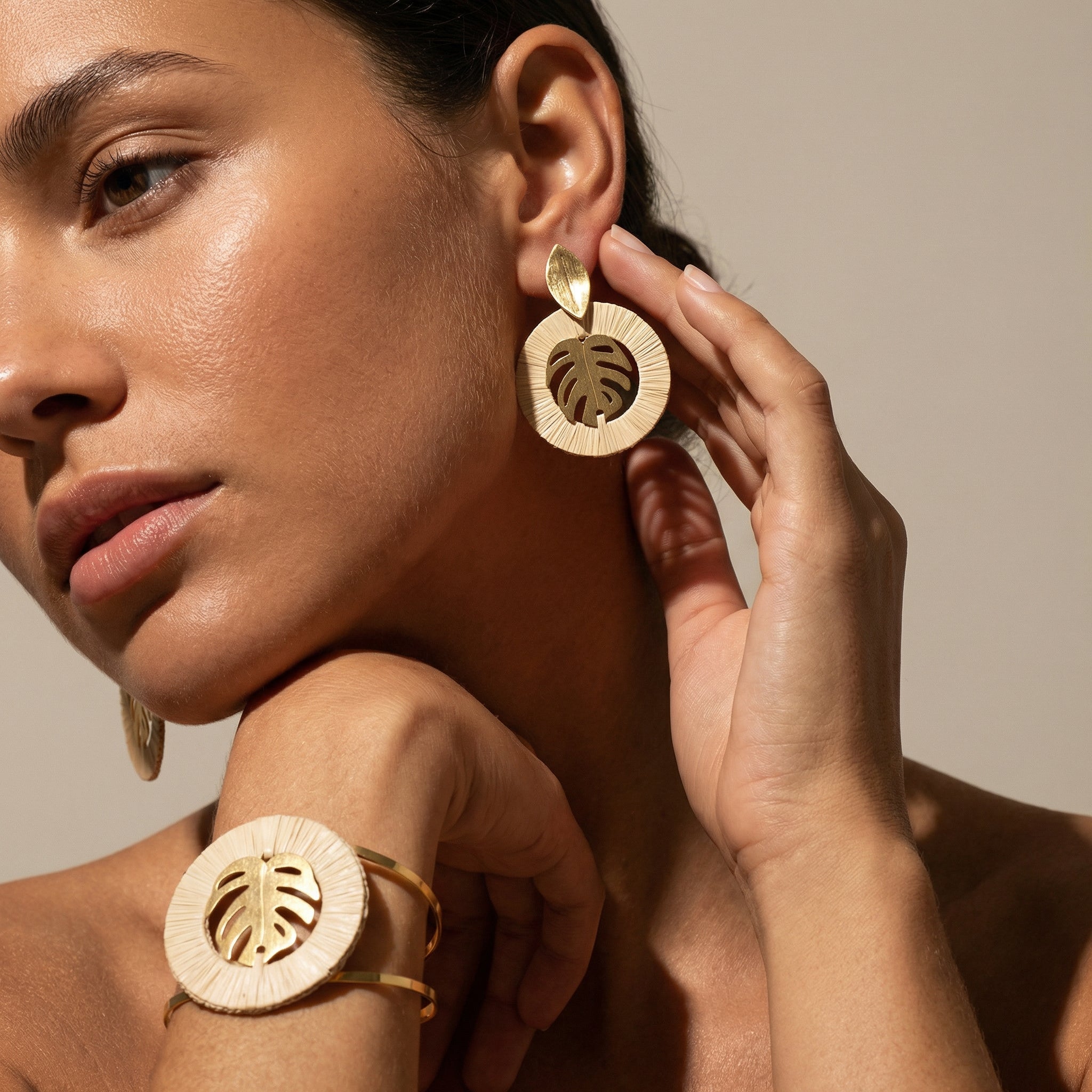 Woman wearing Buriti Handcrafted Jewelry Set with 18k Gold Finish with a neutral background. Purplee Store