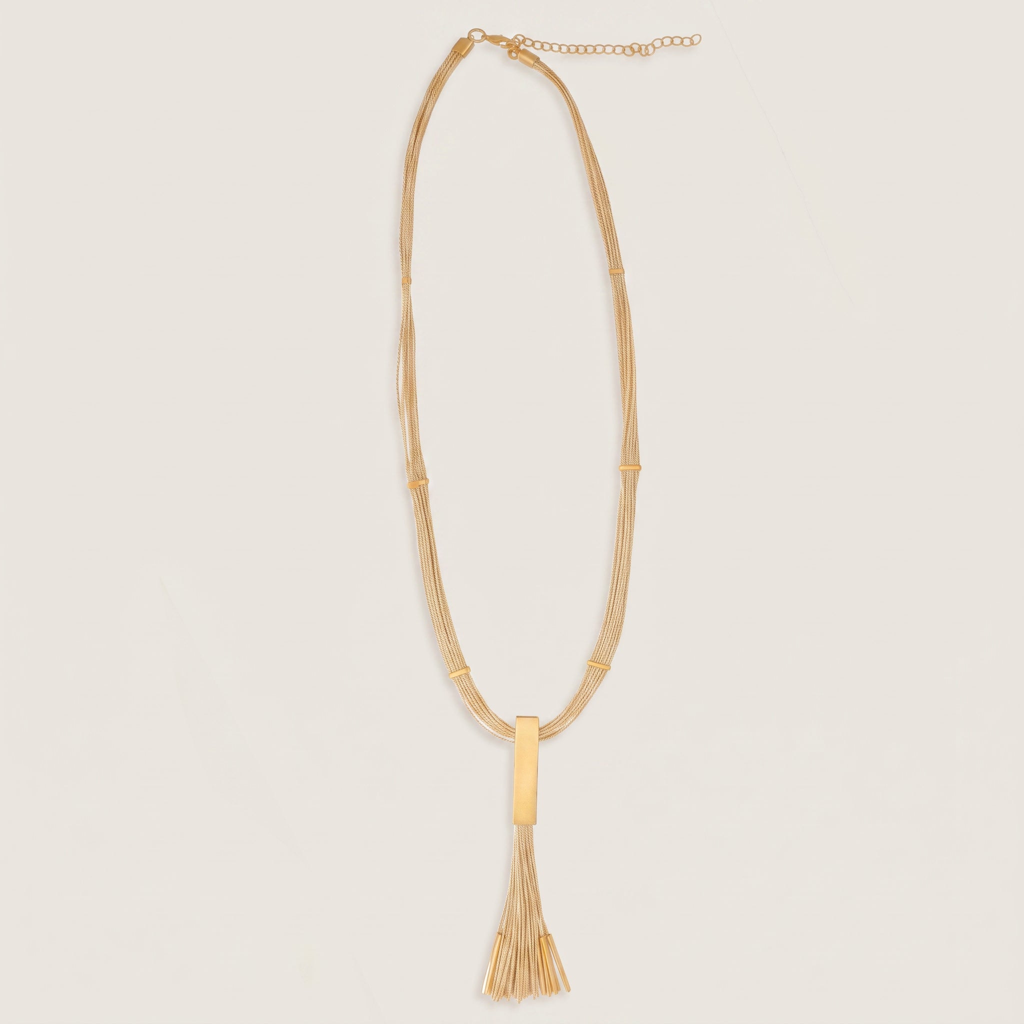 Purplee Store Buriti Statement Elorya Necklace with a unique pendant on a beige background