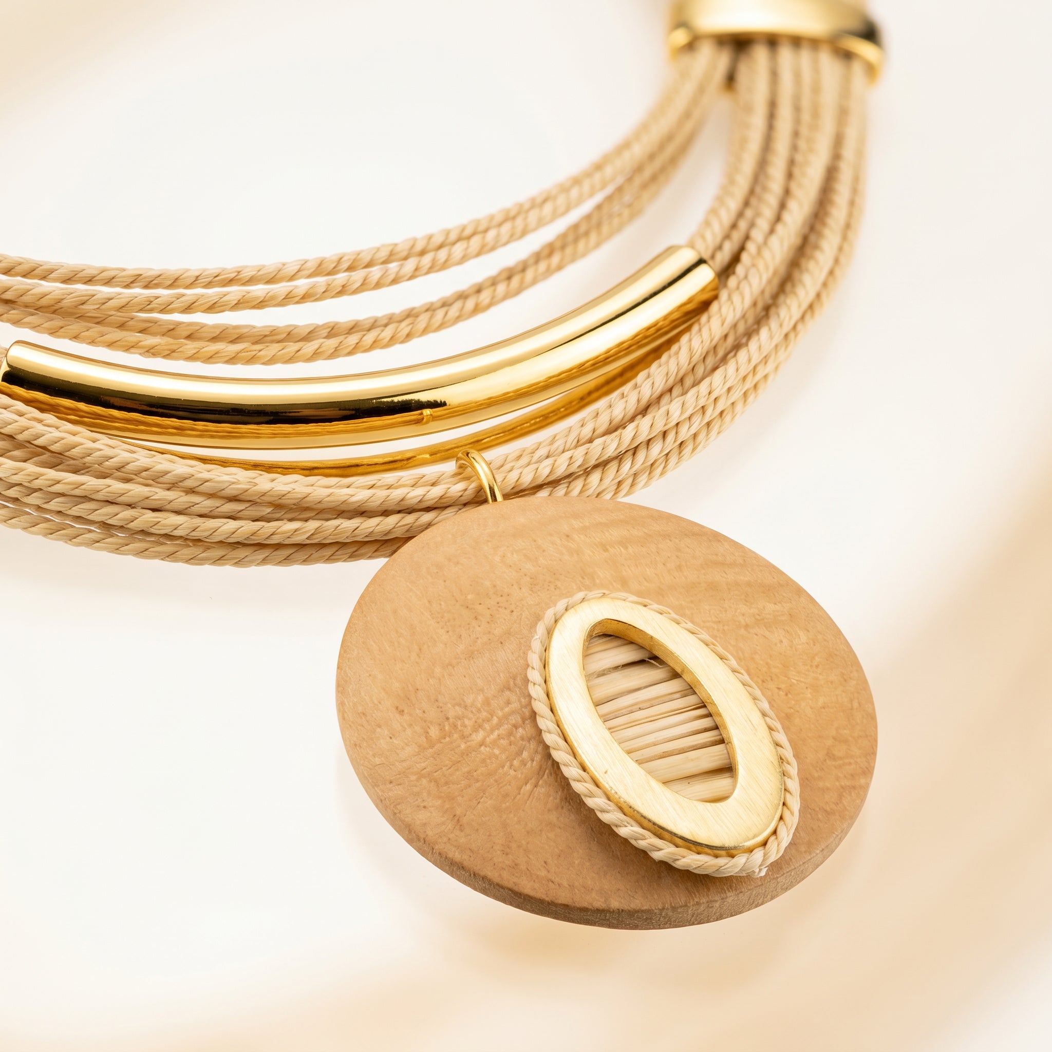 Close-up a Purplee Store Buriti Statement Vireli Set with natural wood on a beige background