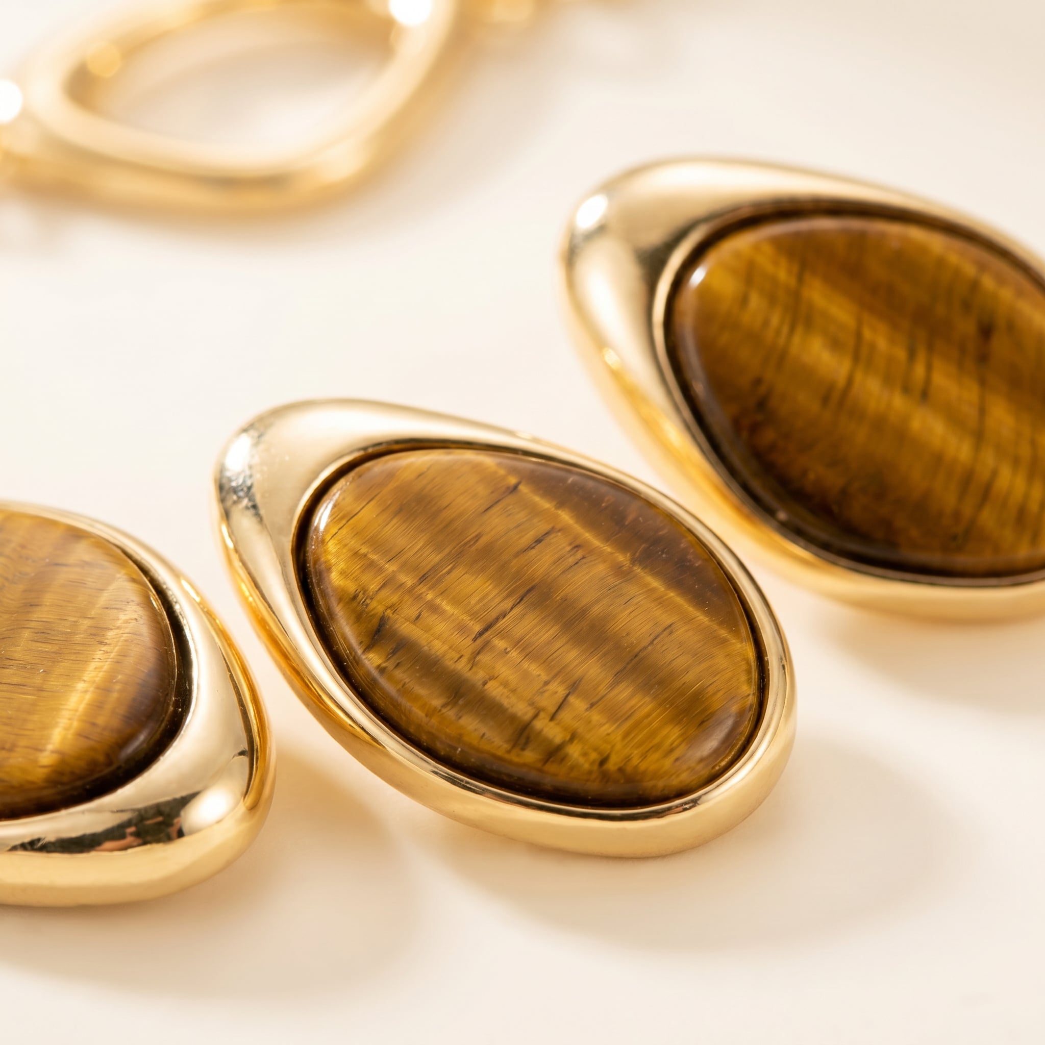 Close-up on a Purplee Store Earthly Opulence Ethereal Tiger’s Eye Statement Set on a light background