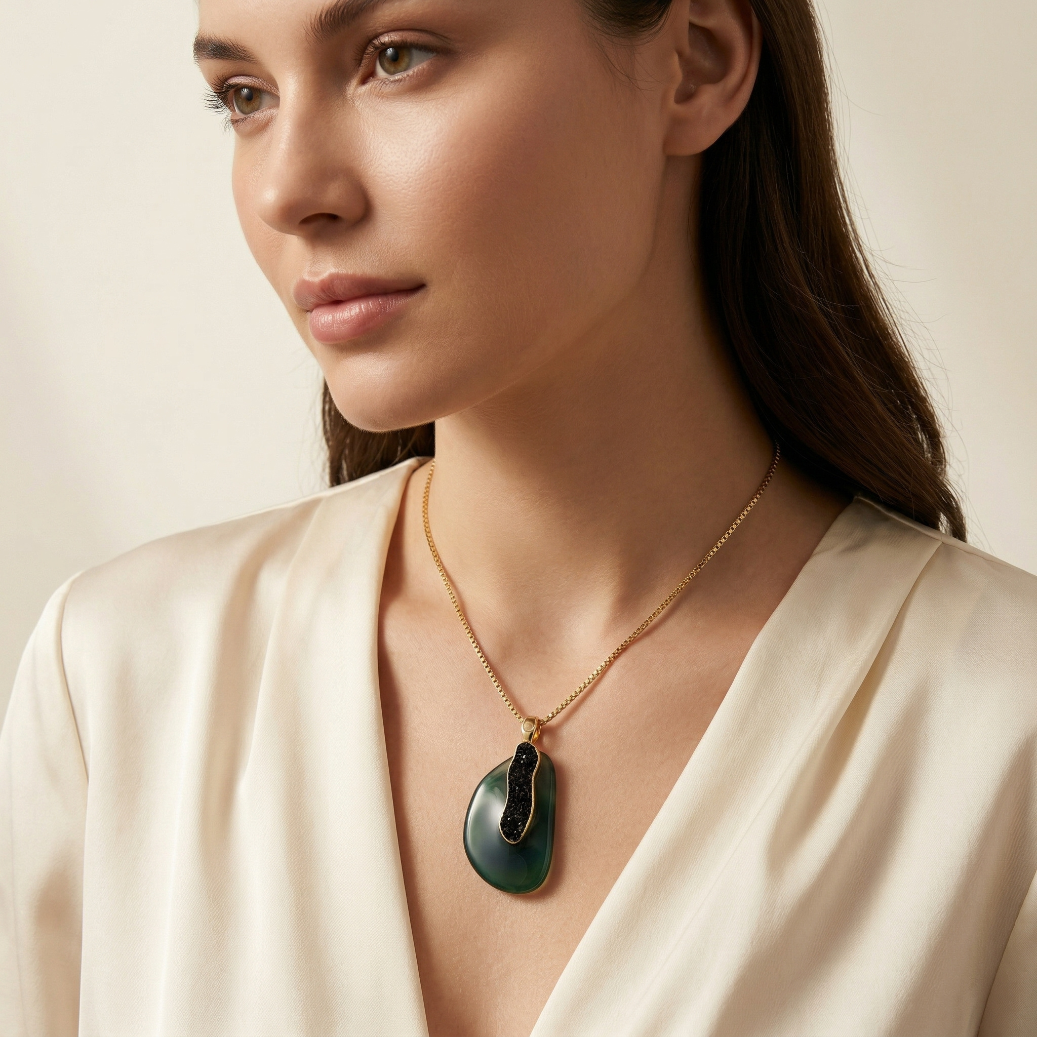 Woman wearing a Earthly Opulence Emerald Gemstone Necklace -Purplee Storeagainst a neutral background