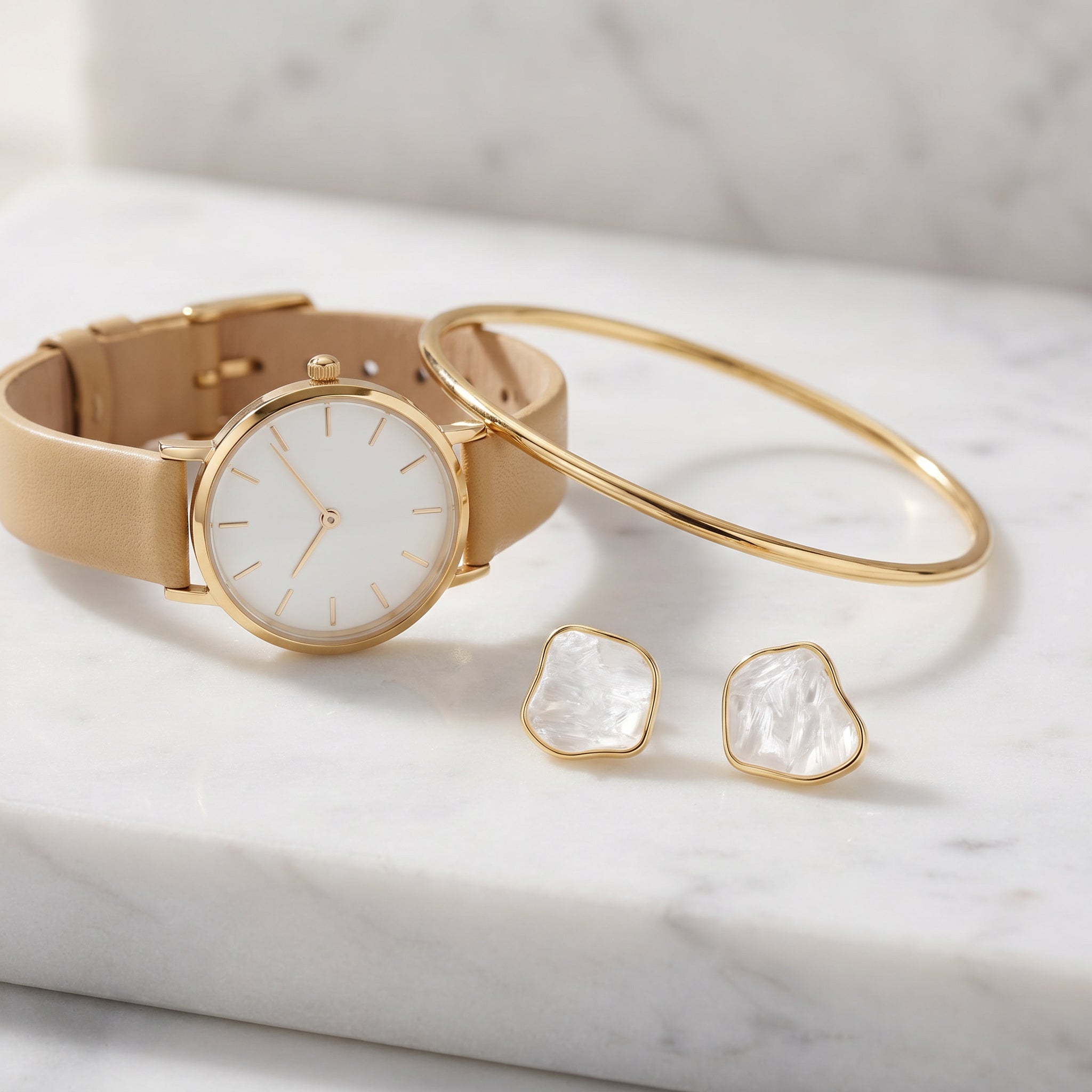 Watch, bracelet, and Purplee Store Earthly Opulence Sublime Gemstone Studs on a marble surface