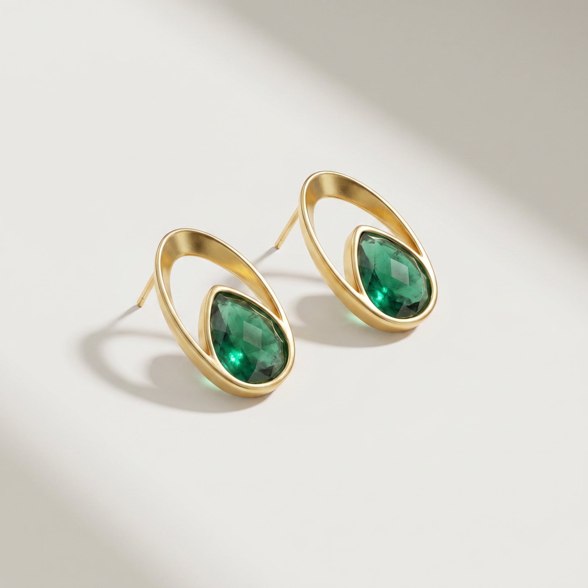 Purplee Store Emerald Orbit Earrings on a light background
