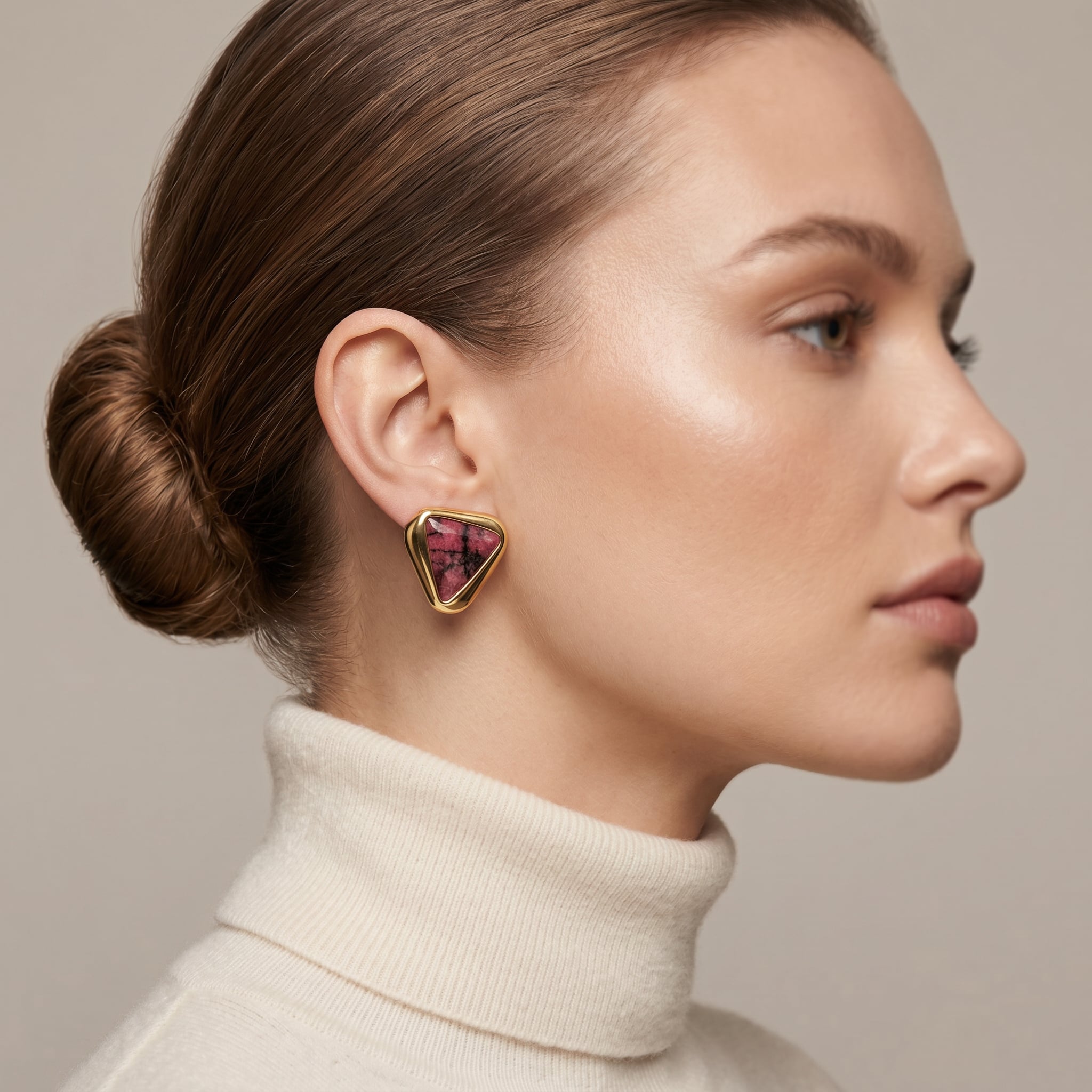 Woman wearing a Purplee Store ICON Eclipse Rhodonite Statement Earrings on a neutral background