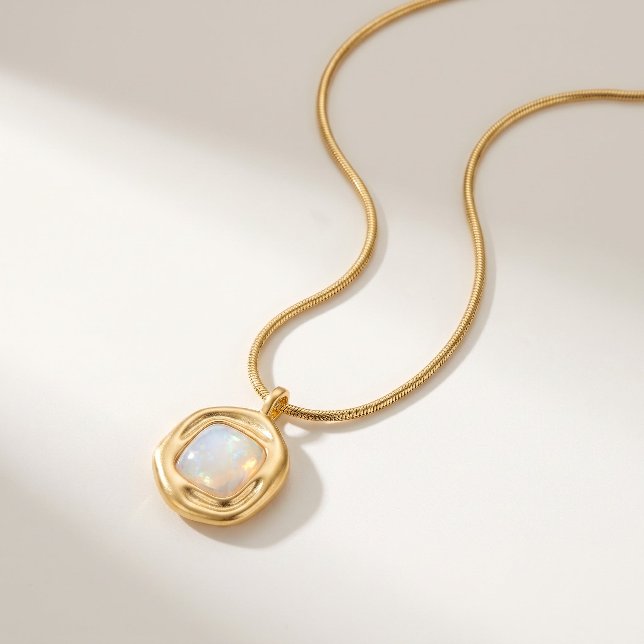 Purplee Store ICON Nautilus Opal Architectural Necklace on a light beige background