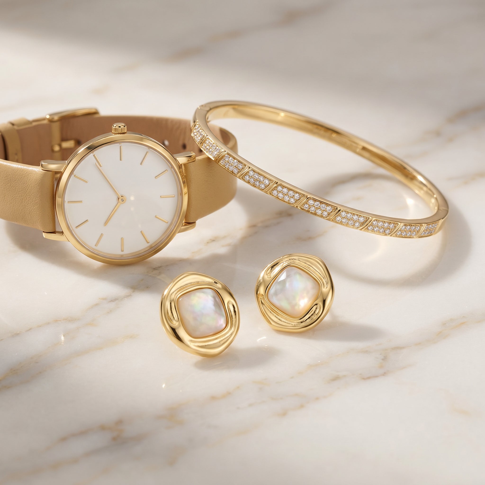 Gold watch, bracelet, and Purplee Store ICON Nautilus Opal Statement Earrings on a marble surface