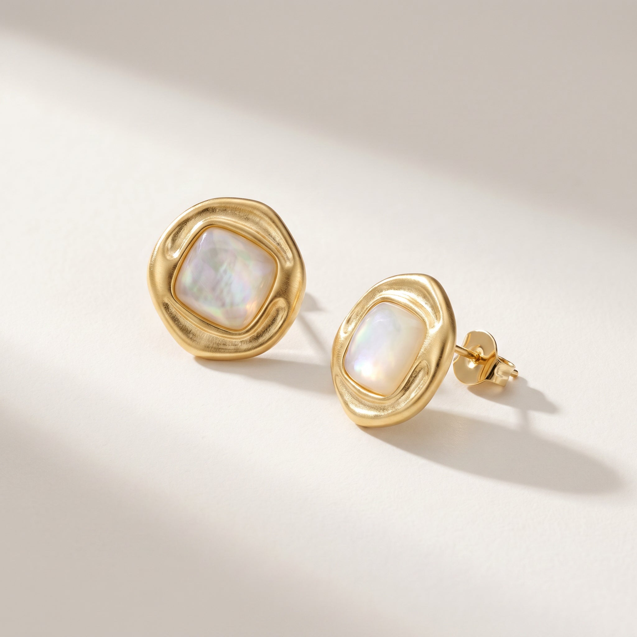 Purplee Store ICON Nautilus Opal Statement Earrings on a beige background