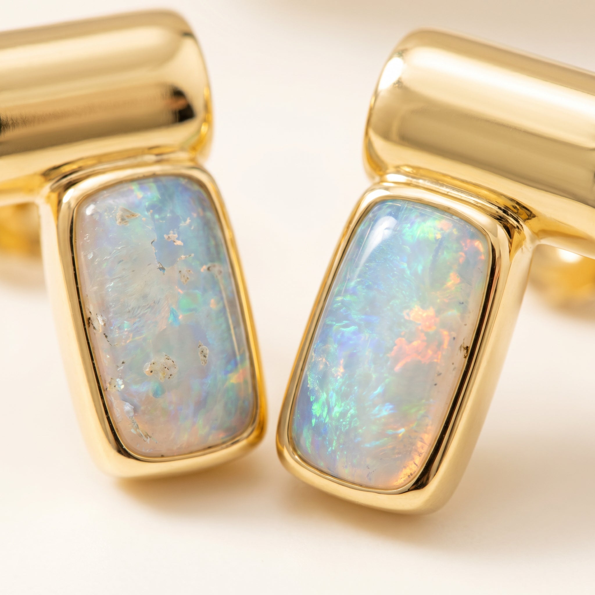 Close-up on Purplee Store ICON Prism Opal Luxury Earrings on a light background
