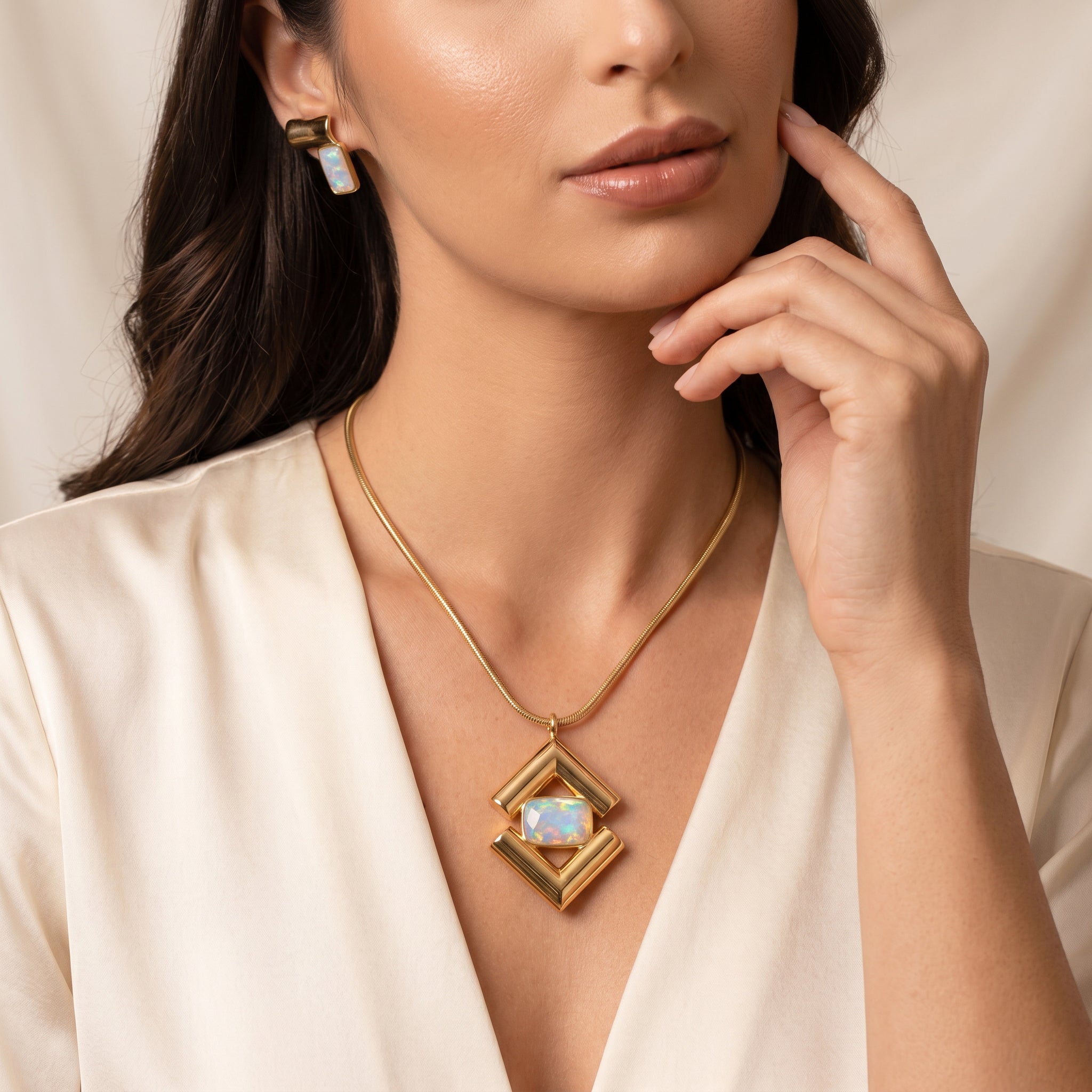 Woman wearing a PurpIee Store ICON Prism Opal Luxury Necklace against a neutral background