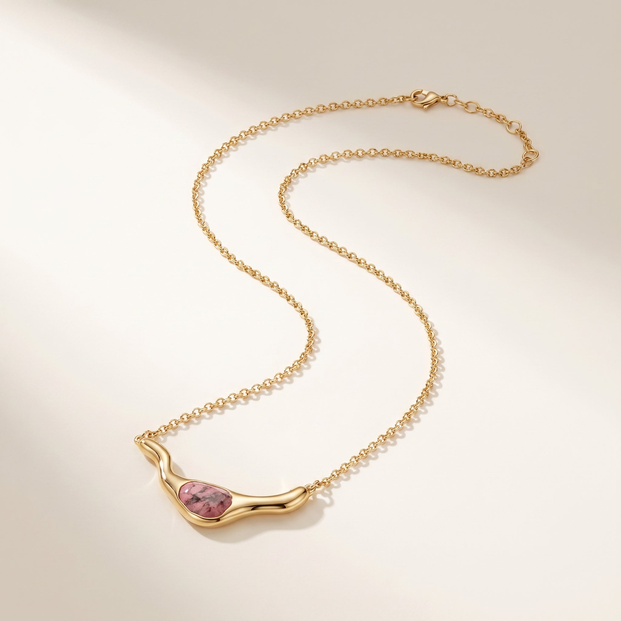 Purplee Store ICON Rhodonite Statement Necklace on a beige background