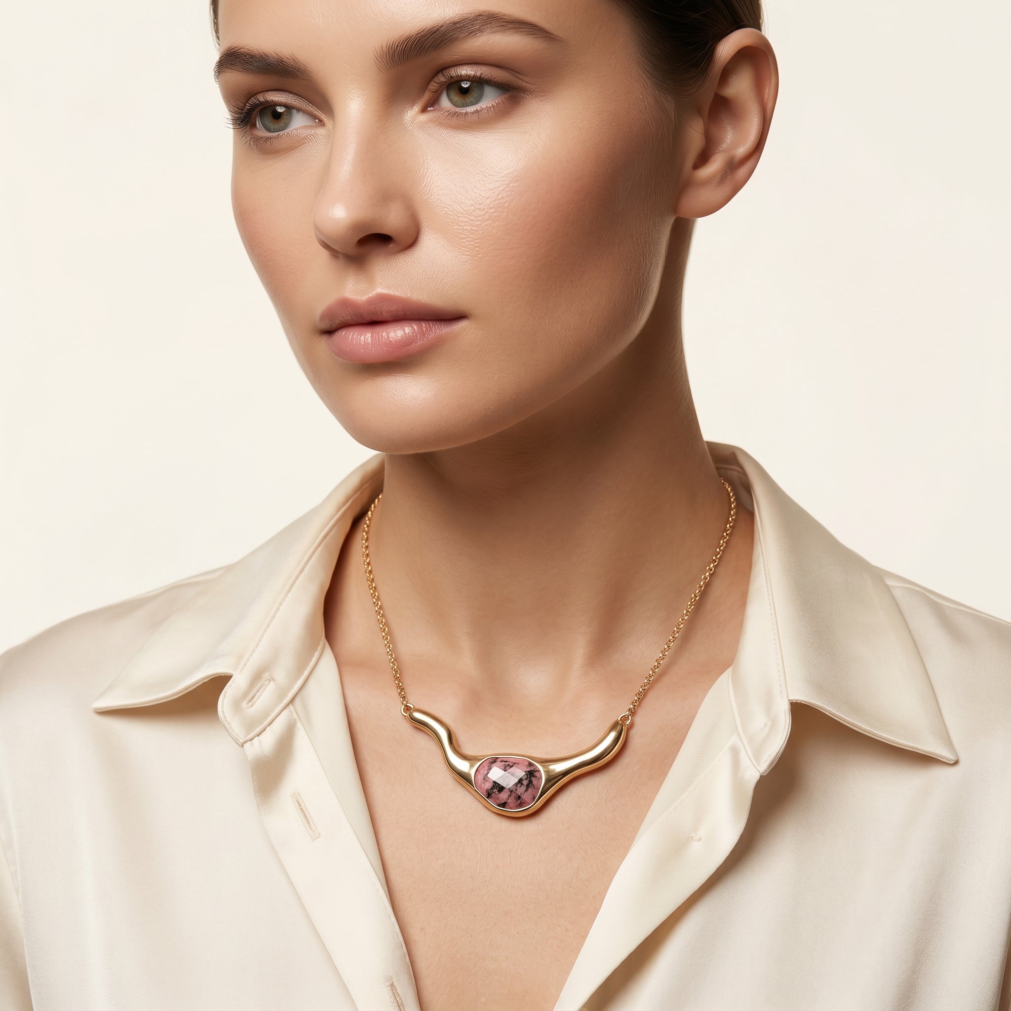 Woman wearing a Purplee Store ICON Rhodonite Statement Necklace on a neutral background