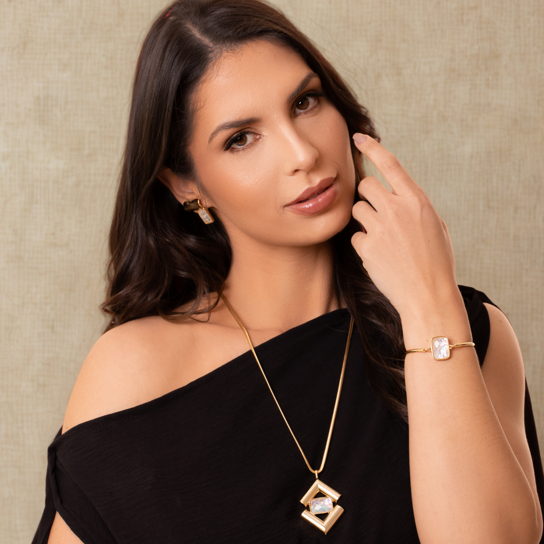 Model2 using an ICON Prism SET in 18k Gold & Opal of the Sea Purplee Store