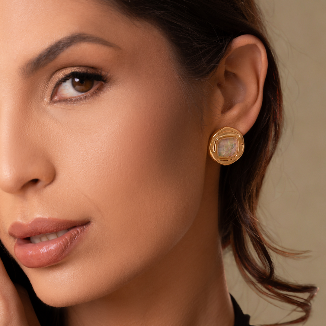 Woman using an ICON Current Hoop Earrings Purplee Store
