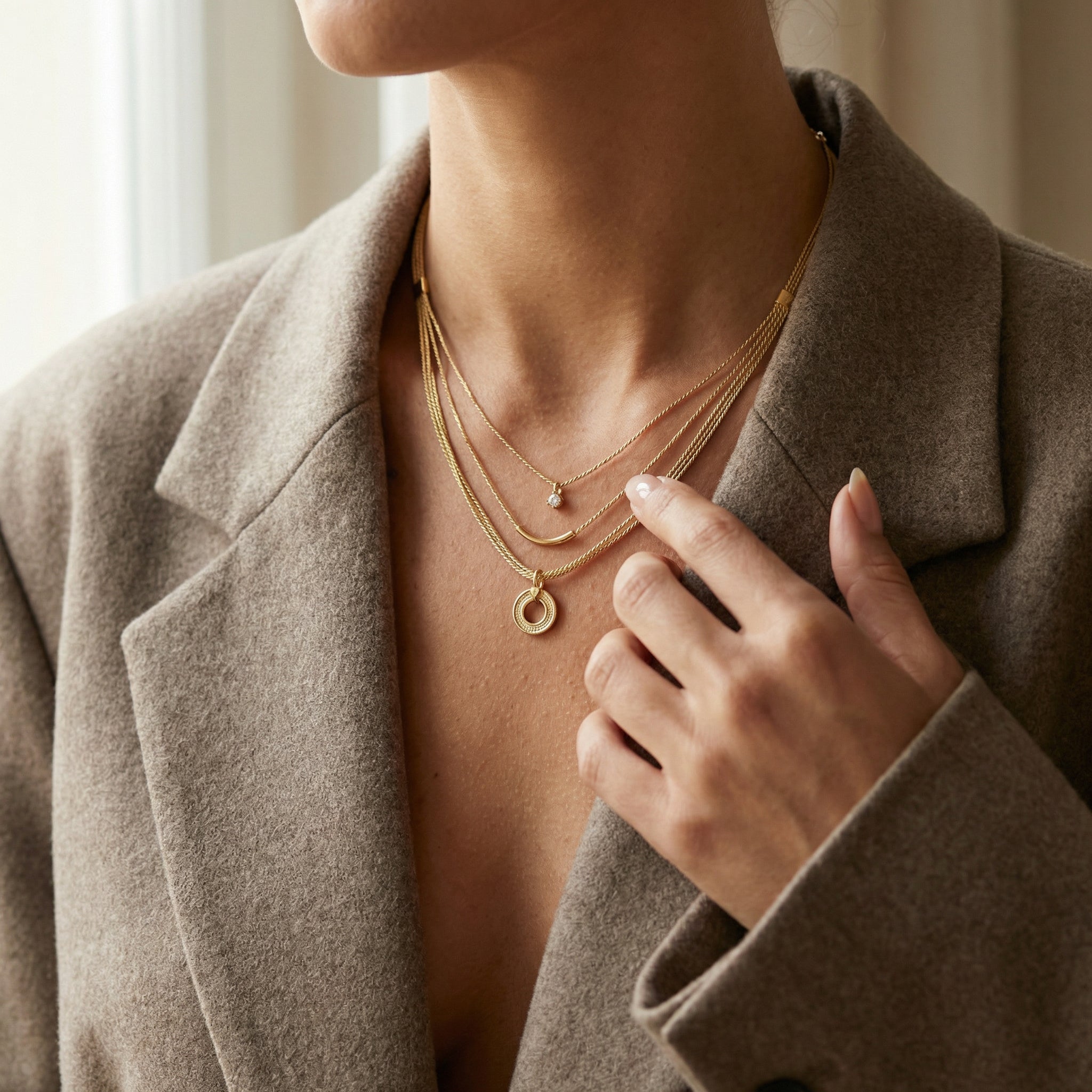 Woman wearing a Nireya: Buriti Fiber Statement Necklace & Chrysoprase, close-up of neck and hand. Purplee Store
