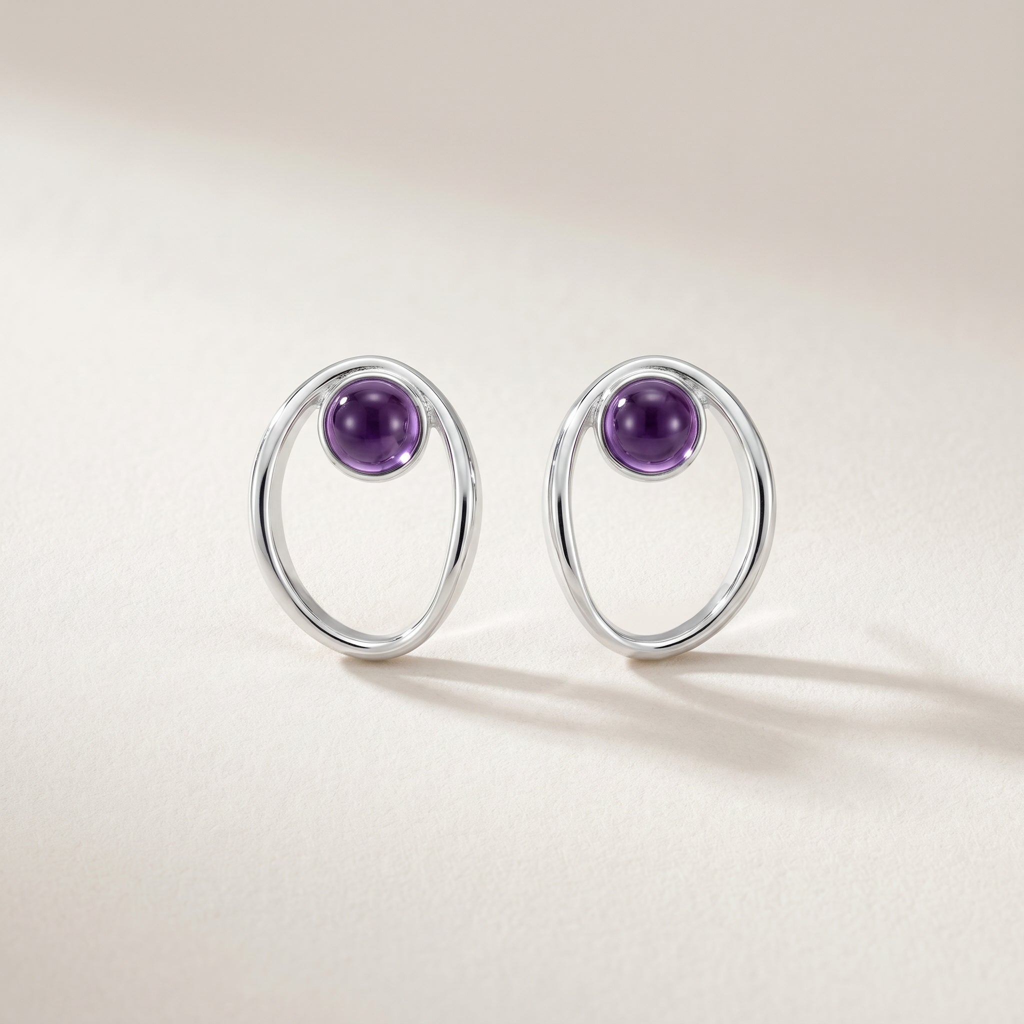 Purplee Store PIORELLE Sculpted Amethyst Earrings on a light beige background