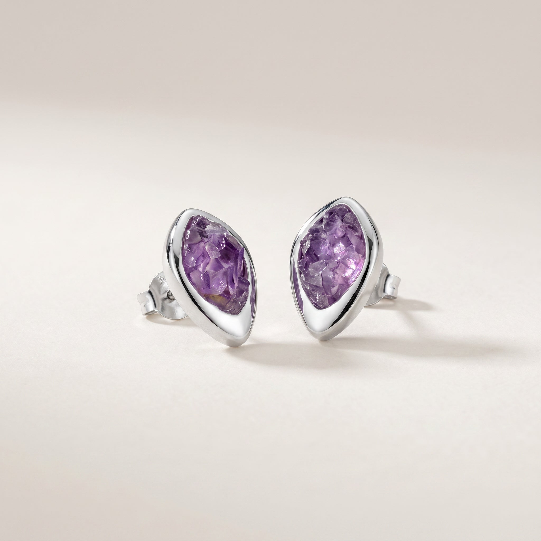 Pair of PIORELLE Amethyst Birthstone earring on a light background.Purplee Store