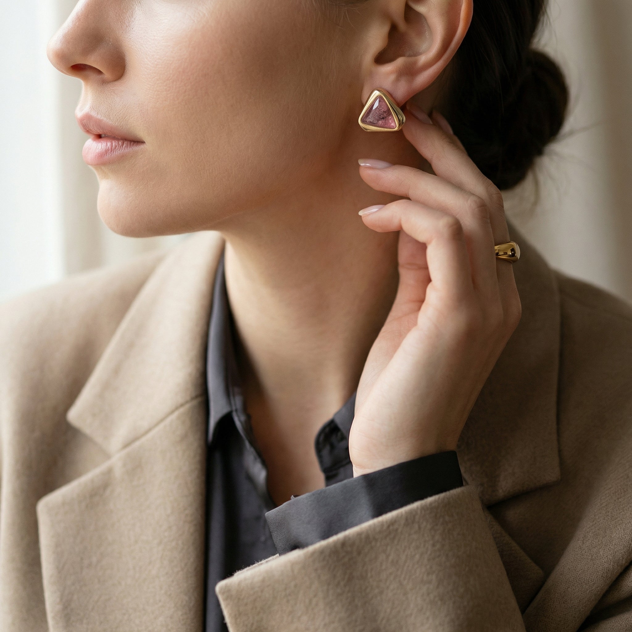 Woman wearing a Premium 24K Gold Plated Statement Earrings with Genuine Red Rhodonite and ring, with a neutral background. Purplee Store