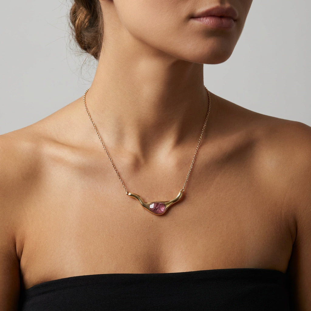 Woman using a Rhodonite 24K Triple Gold Plated Statement Necklace. Purplee Store