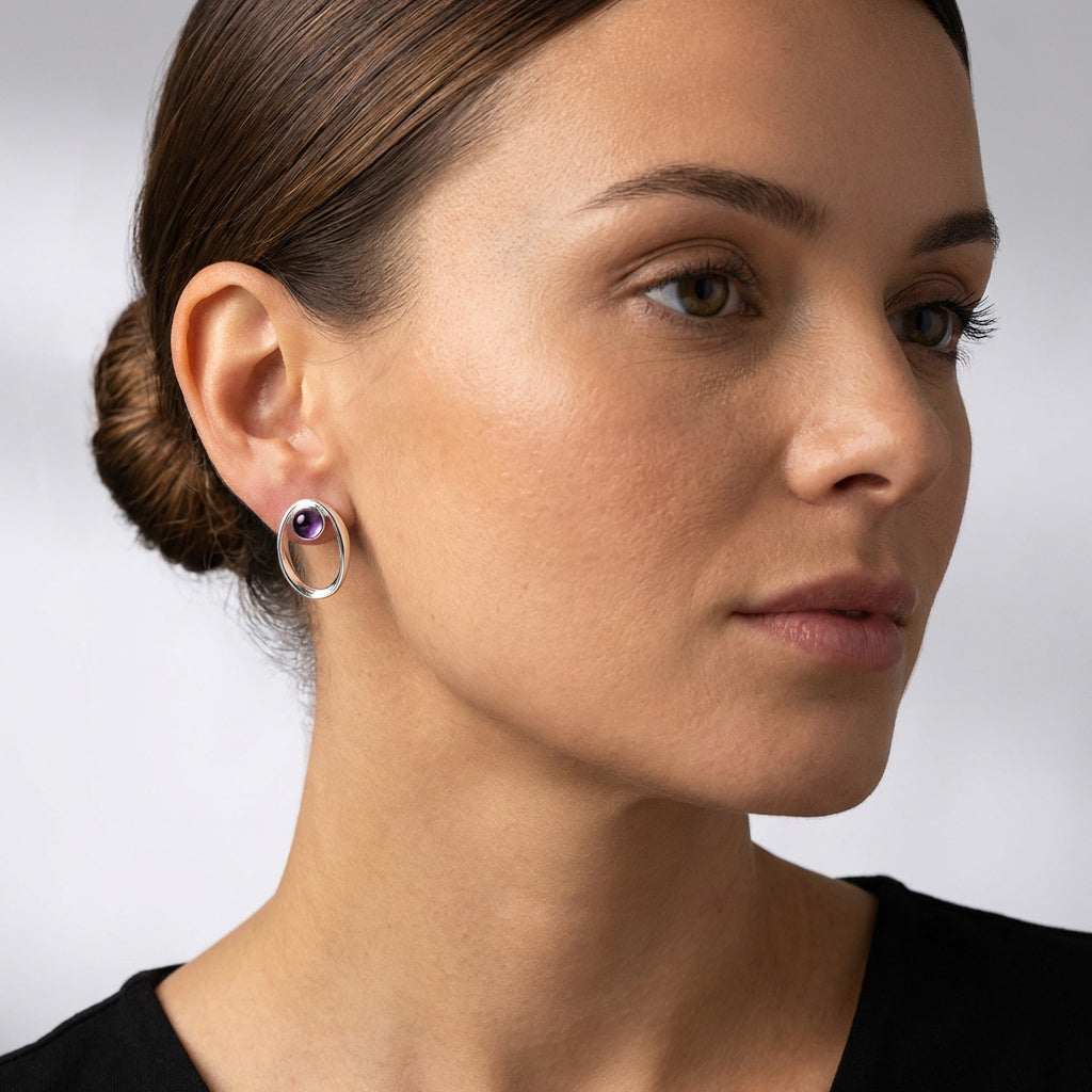 Close-up of a woman wearing a Sterling Silver Amethyst Earrings – Wedding & Bridesmaids on a neutral background. Purplee Store
