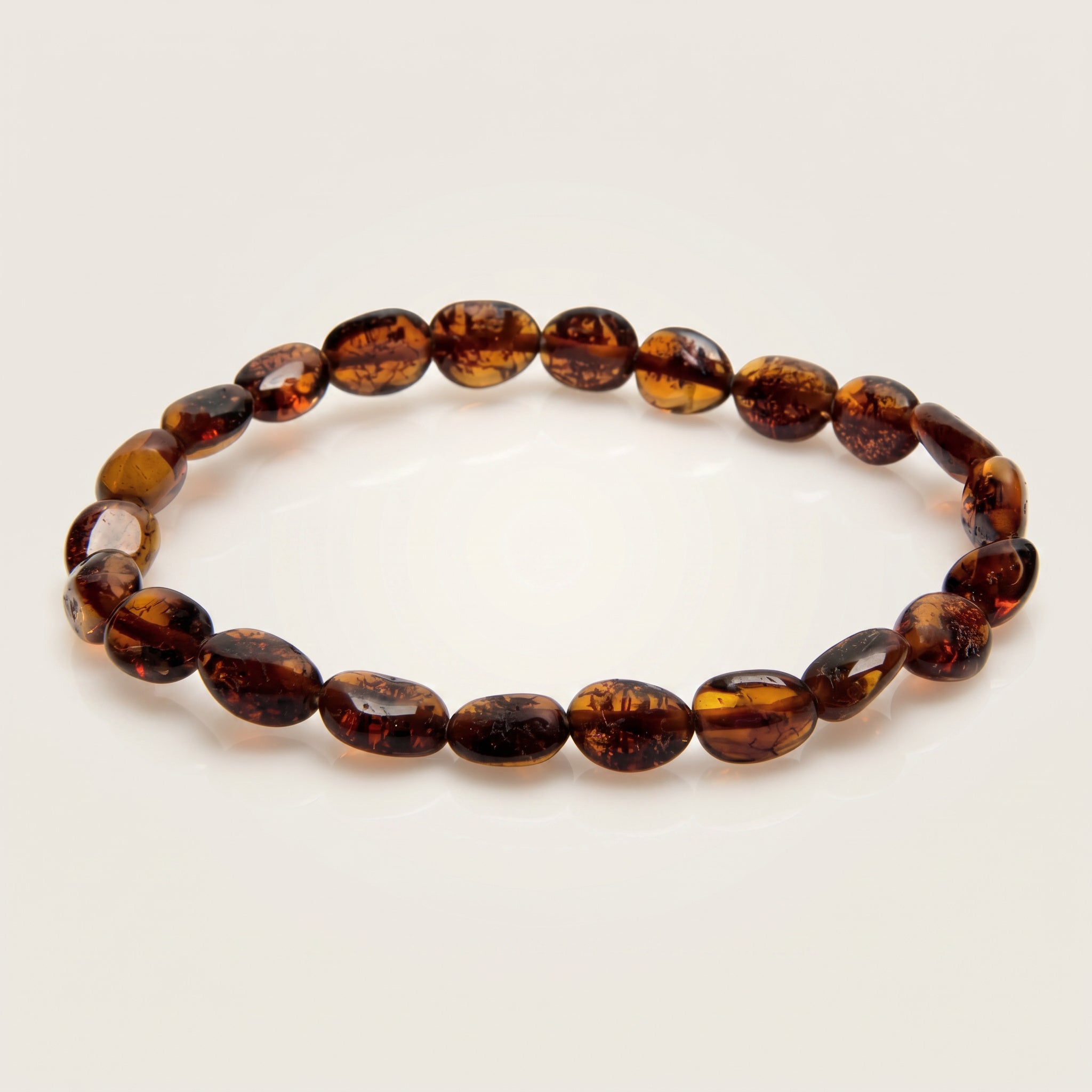 Amber Cognac Energy Olive Bracelet|Purplee Store on a light beige background