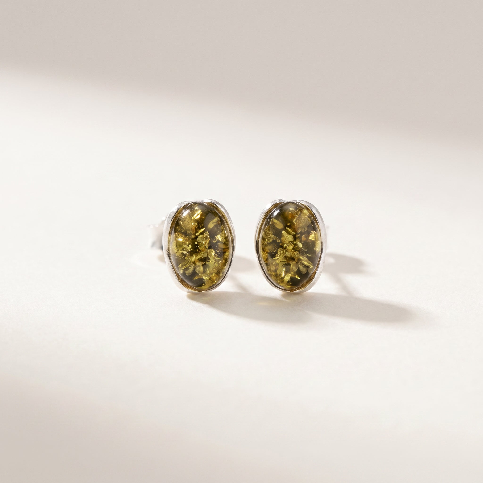 Pair of Amber Glow Forest Green 925 Silver Drops|Purplee Store on a light background