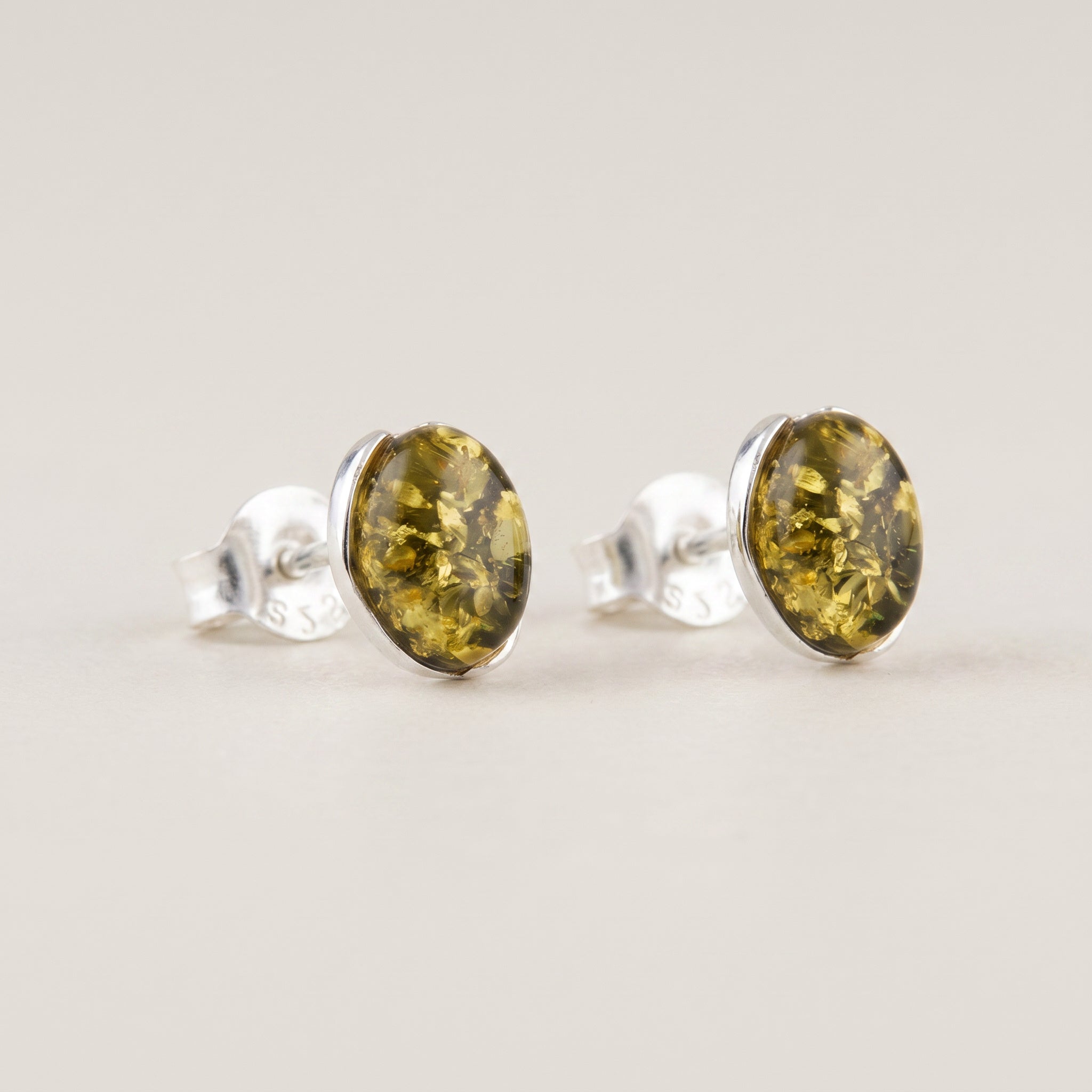 Pair of Amber Glow Forest Green 925 Silver Drops|Purplee Store on a light gray background