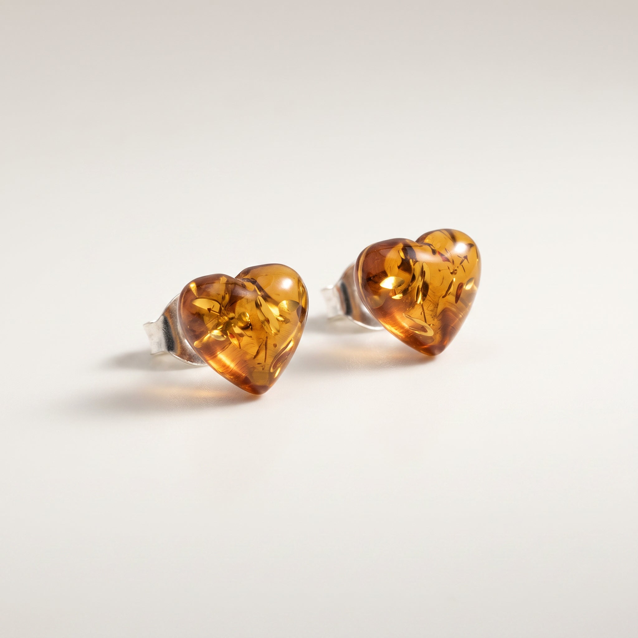 Amare Amber Heart 925 Silver Studs|Purplee Store on a light gray background