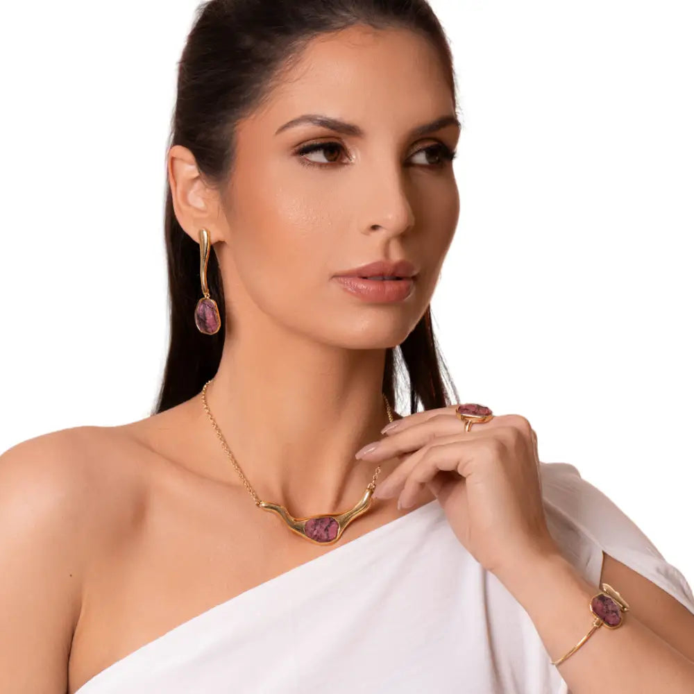 Model using an ICON Flow SET in 18k Gold & Rhodonite