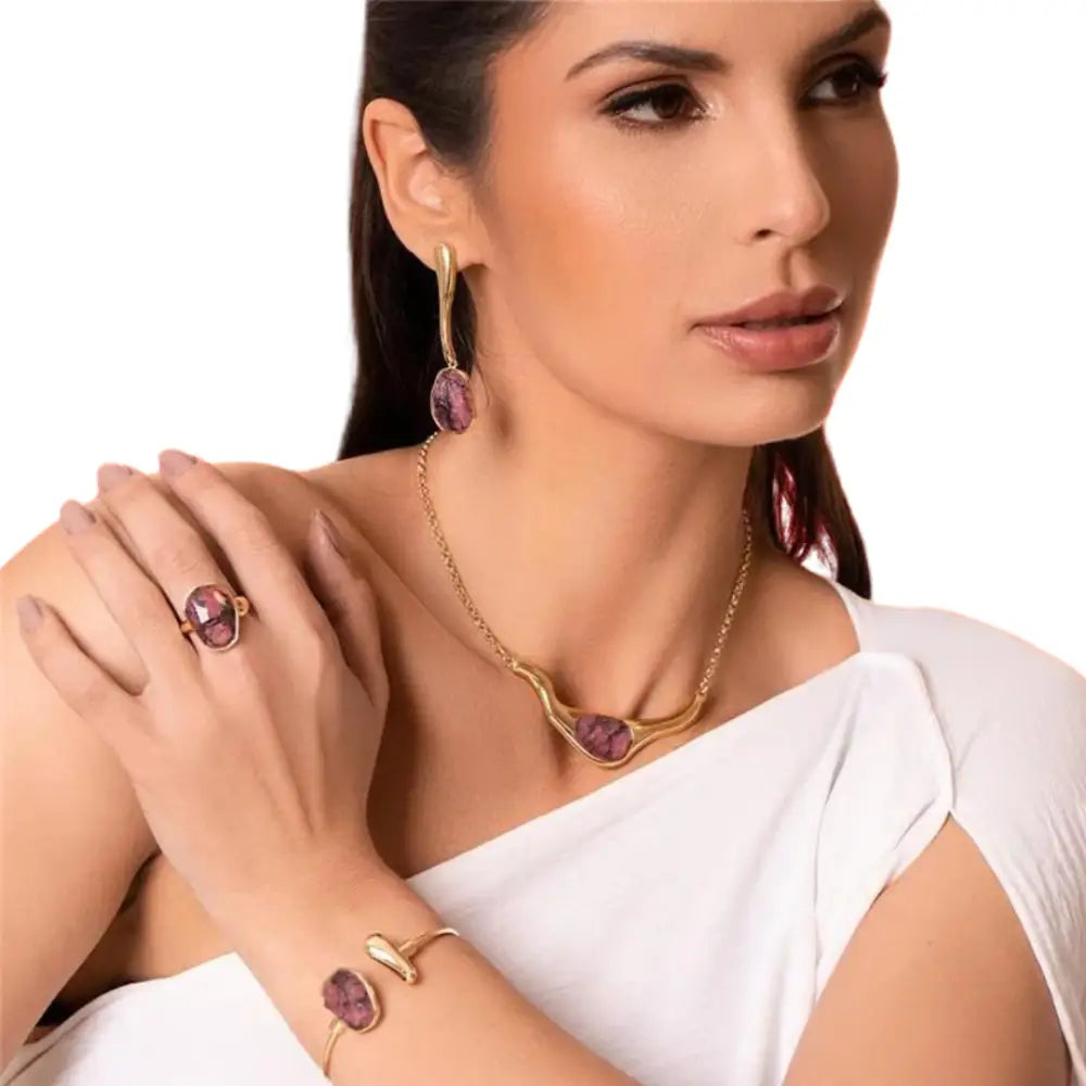 Model using an ICON Flow SET in 18k Gold & Rhodonite