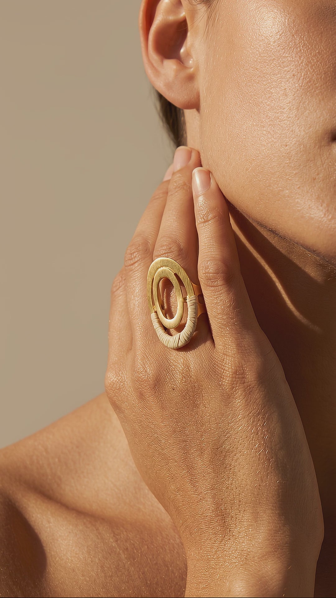 Video woman using a Unique Buriti Sculptural Ring, 18k Gold Accents. Purplee Store