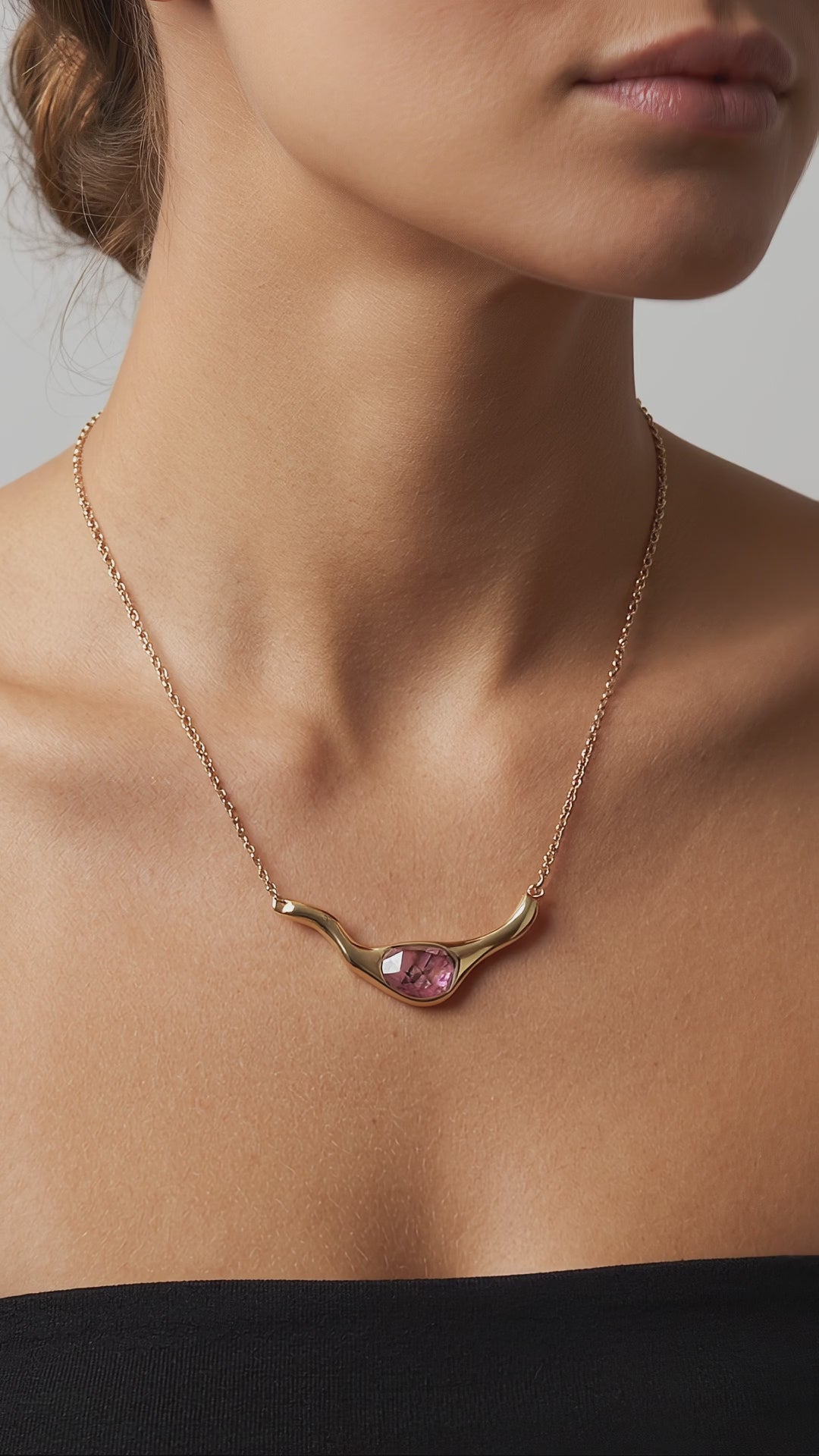 Video of a woman using a Rhodonite 24K Triple Gold Plated Statement Necklace. Purplee Store