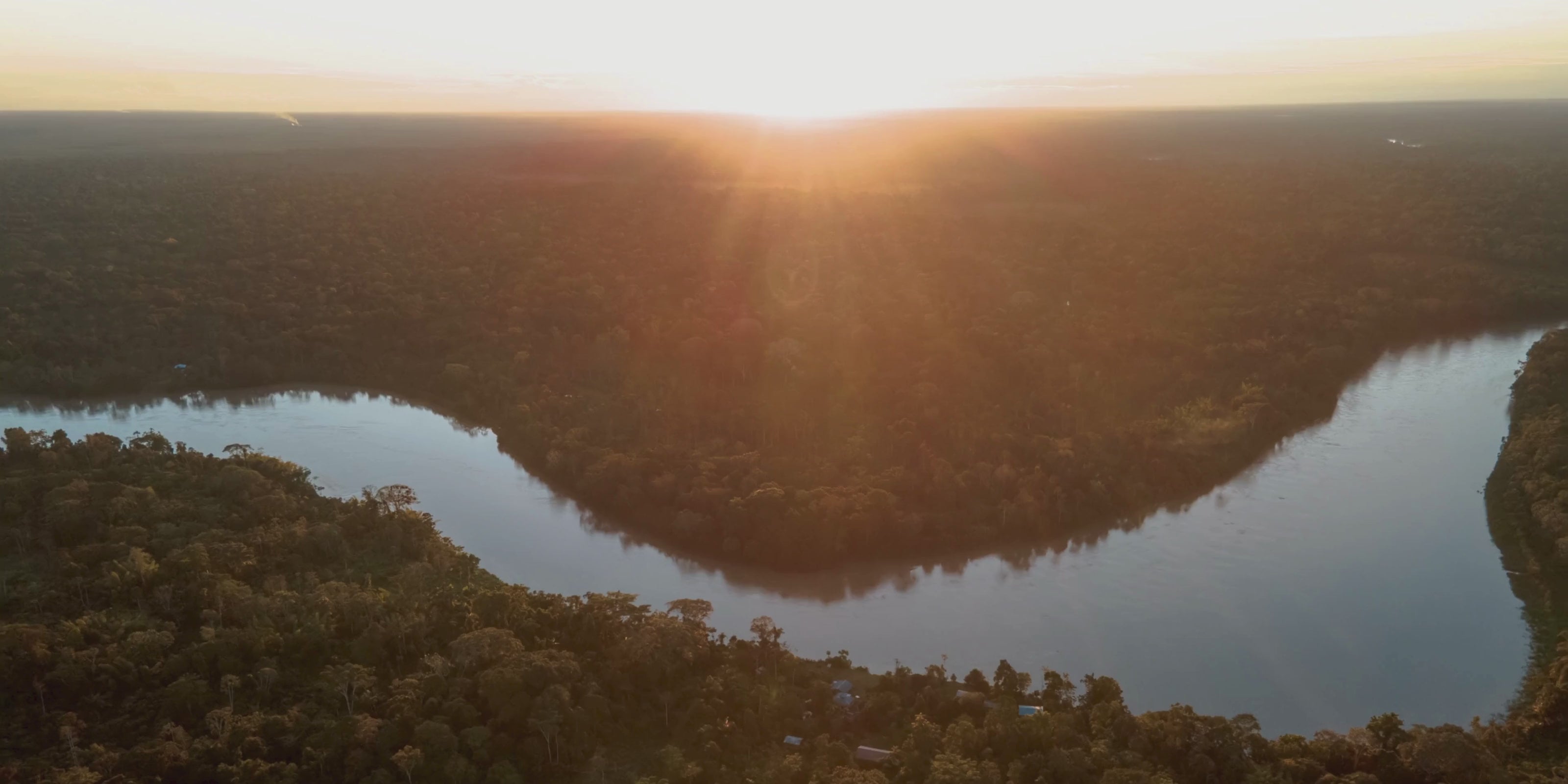 Cinematic sunset view of the Amazon river, the sustainable source of Buriti fiber for  Purplee Store